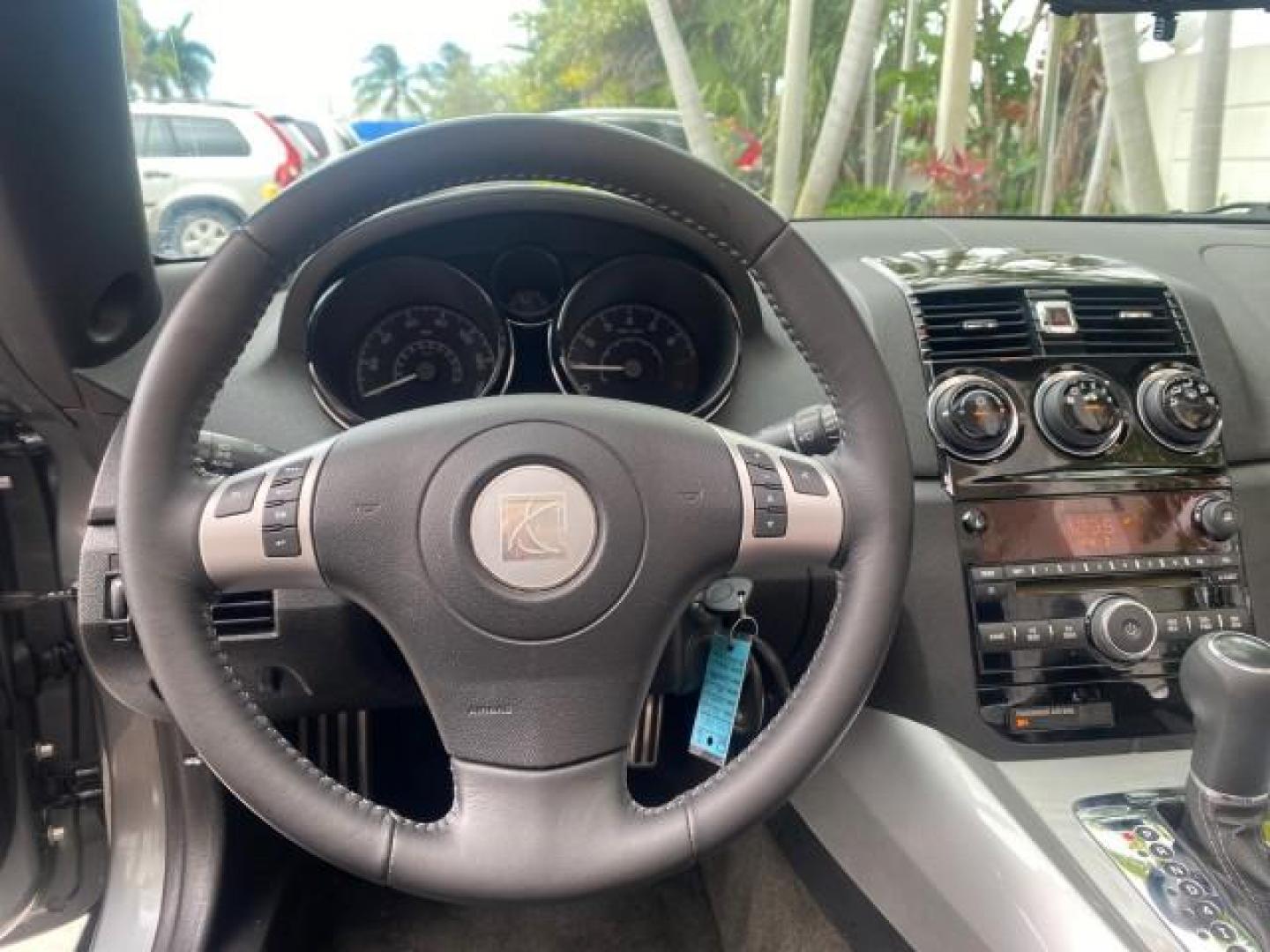 2007 Silver Graphite /Black Saturn Sky CONV LOW MILES 42,288 1 OWNER (1G8MB35B47Y) with an 2.4L DOHC VVT I4 Aluminum Ecotec Engine engine, Automatic transmission, located at 4701 North Dixie Hwy, Pompano Beach, FL, 33064, (954) 422-2889, 26.240938, -80.123474 - OUR WEBPAGE FLORIDACARS1.COM HAS OVER 100 PHOTOS AND FREE CARFAX LINK 2007 Saturn SKY 1 OWNER Convertible 2.4L I4 F DOHC Gasoline 28 MPG Rear Wheel Drive Features ABS Brakes Air Conditioning Alloy Wheels AM/FM Stereo Automatic Transmission Auxiliary Audio Input CD Audio Cruise Control Leather Seats - Photo#69