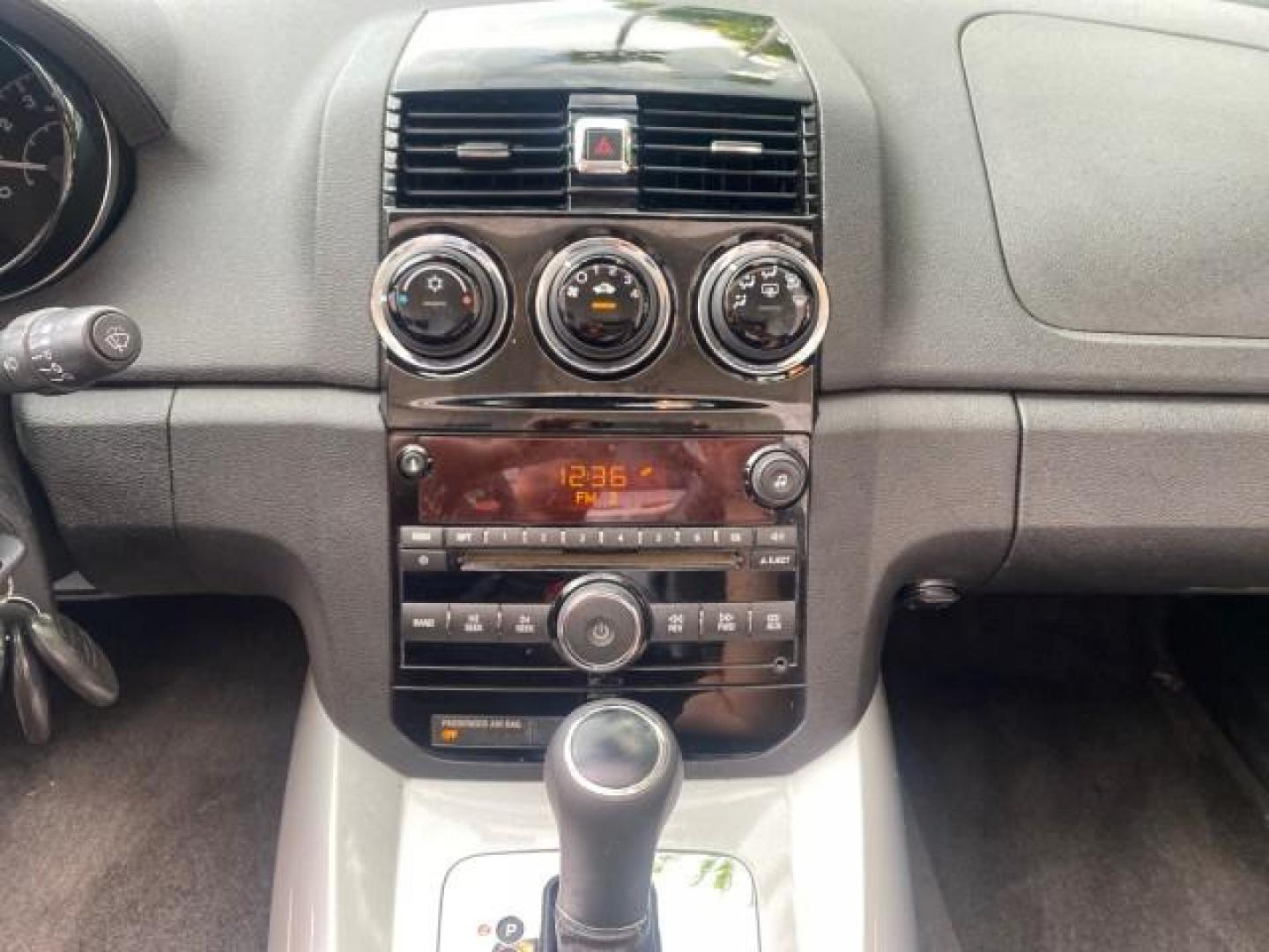 2007 Silver Graphite /Black Saturn Sky CONV LOW MILES 42,288 1 OWNER (1G8MB35B47Y) with an 2.4L DOHC VVT I4 Aluminum Ecotec Engine engine, Automatic transmission, located at 4701 North Dixie Hwy, Pompano Beach, FL, 33064, (954) 422-2889, 26.240938, -80.123474 - OUR WEBPAGE FLORIDACARS1.COM HAS OVER 100 PHOTOS AND FREE CARFAX LINK 2007 Saturn SKY 1 OWNER Convertible 2.4L I4 F DOHC Gasoline 28 MPG Rear Wheel Drive Features ABS Brakes Air Conditioning Alloy Wheels AM/FM Stereo Automatic Transmission Auxiliary Audio Input CD Audio Cruise Control Leather Seats - Photo#77