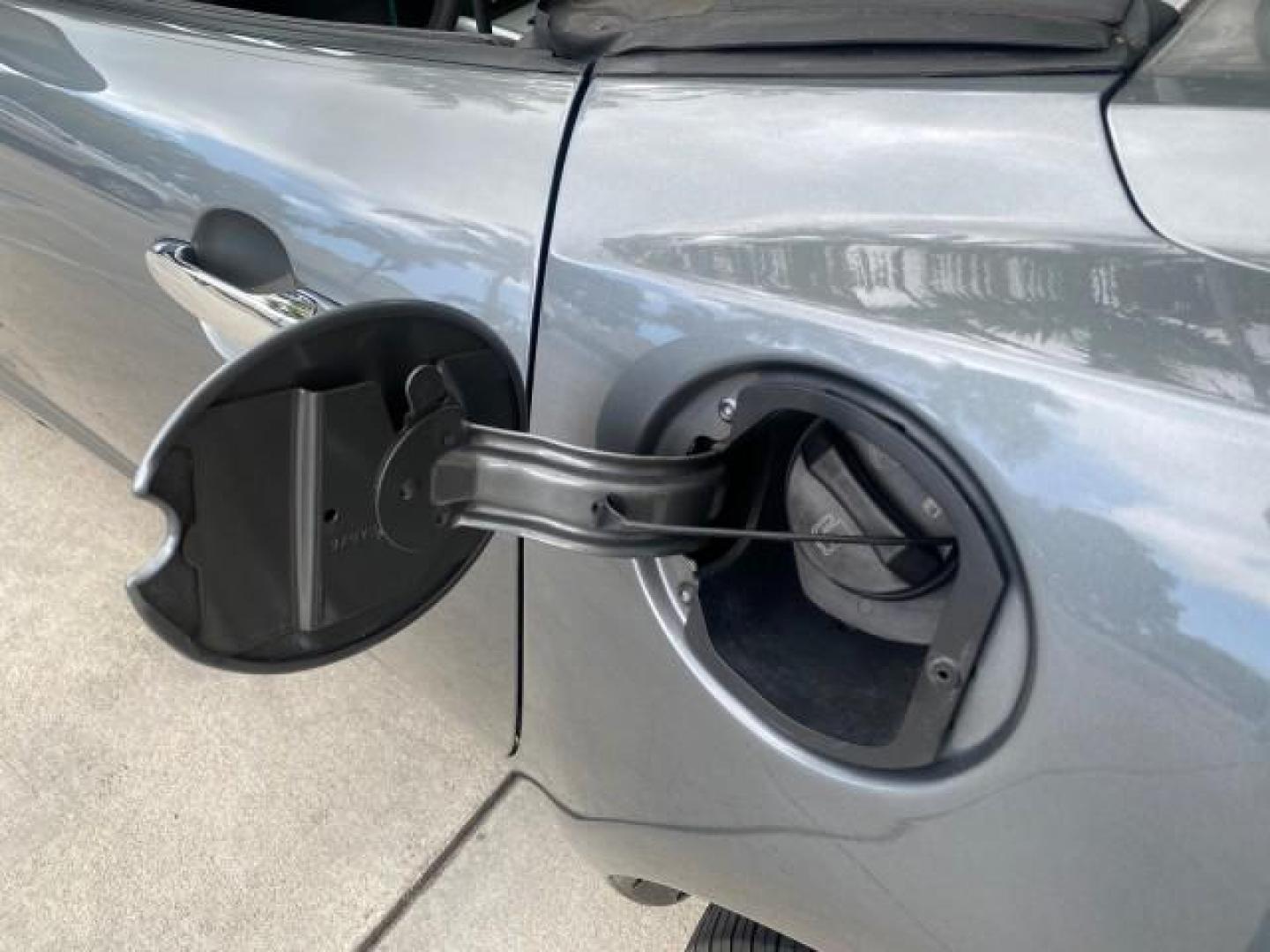 2007 Silver Graphite /Black Saturn Sky CONV LOW MILES 42,288 1 OWNER (1G8MB35B47Y) with an 2.4L DOHC VVT I4 Aluminum Ecotec Engine engine, Automatic transmission, located at 4701 North Dixie Hwy, Pompano Beach, FL, 33064, (954) 422-2889, 26.240938, -80.123474 - OUR WEBPAGE FLORIDACARS1.COM HAS OVER 100 PHOTOS AND FREE CARFAX LINK 2007 Saturn SKY 1 OWNER Convertible 2.4L I4 F DOHC Gasoline 28 MPG Rear Wheel Drive Features ABS Brakes Air Conditioning Alloy Wheels AM/FM Stereo Automatic Transmission Auxiliary Audio Input CD Audio Cruise Control Leather Seats - Photo#93