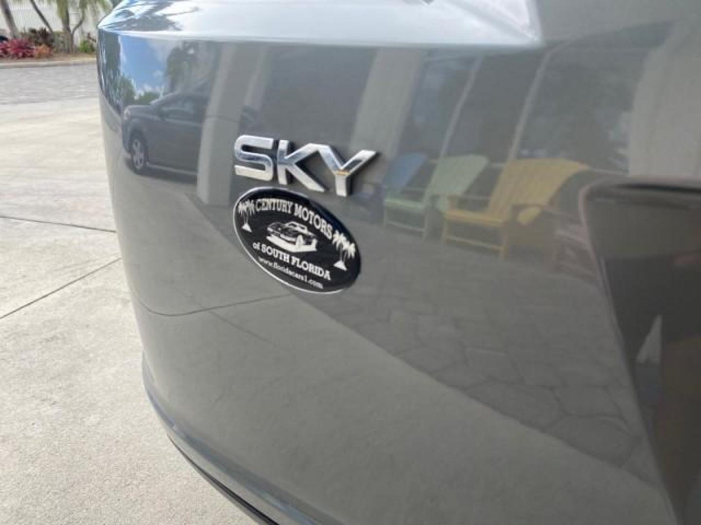 2007 Silver Graphite /Black Saturn Sky CONV LOW MILES 42,288 1 OWNER (1G8MB35B47Y) with an 2.4L DOHC VVT I4 Aluminum Ecotec Engine engine, Automatic transmission, located at 4701 North Dixie Hwy, Pompano Beach, FL, 33064, (954) 422-2889, 26.240938, -80.123474 - OUR WEBPAGE FLORIDACARS1.COM HAS OVER 100 PHOTOS AND FREE CARFAX LINK 2007 Saturn SKY 1 OWNER Convertible 2.4L I4 F DOHC Gasoline 28 MPG Rear Wheel Drive Features ABS Brakes Air Conditioning Alloy Wheels AM/FM Stereo Automatic Transmission Auxiliary Audio Input CD Audio Cruise Control Leather Seats - Photo#98