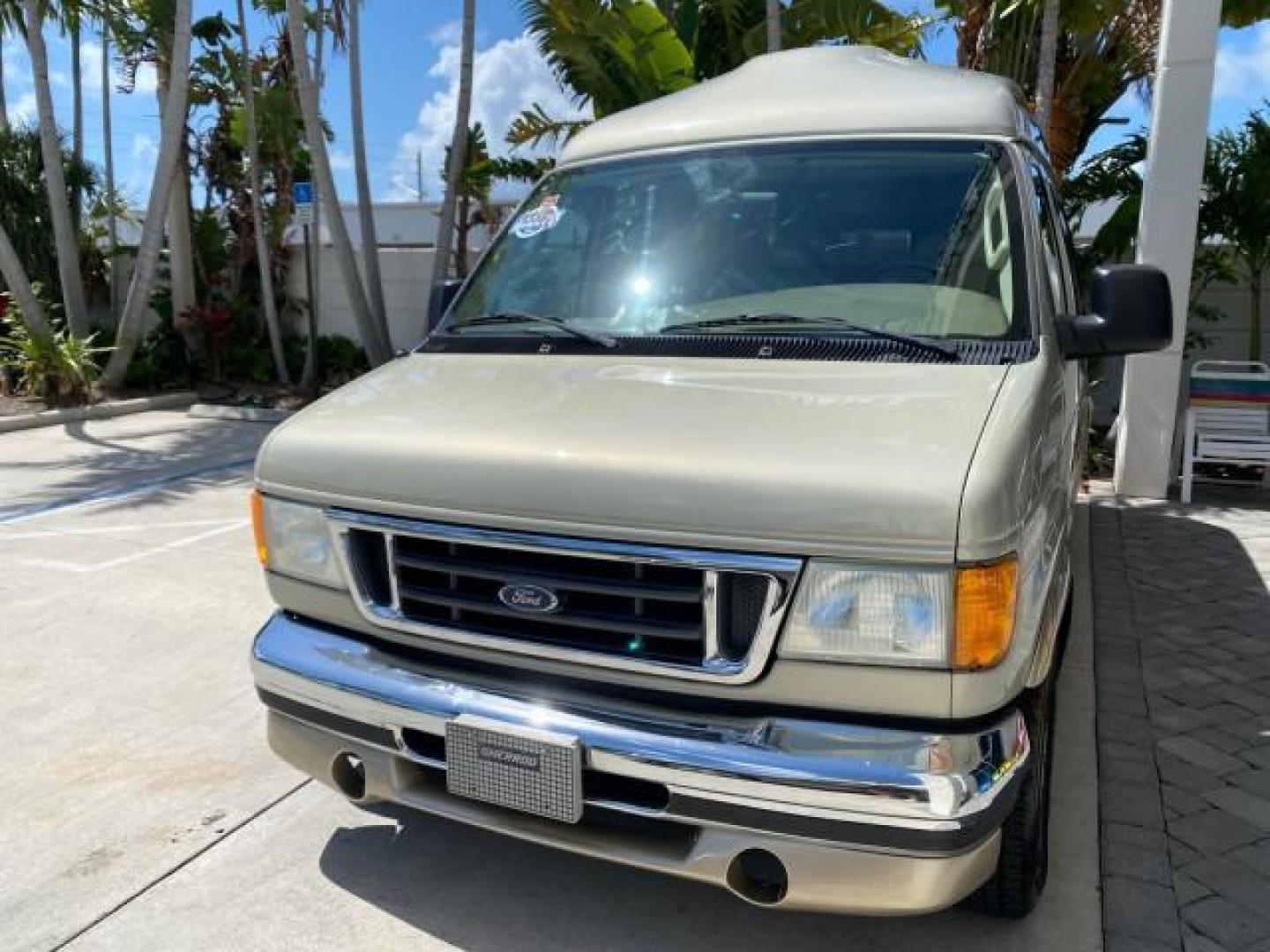 2004 Gold Ash Metallic /Medium Pebble Ford Econoline HIGH TOP CONVERSION VAN 1 OWNER LOW MILES 37,883 (1FDRE14L64H) with an 5.4L SOHC EFI V8 Triton Engine engine, Automatic transmission, located at 4701 North Dixie Hwy, Pompano Beach, FL, 33064, (954) 422-2889, 26.240938, -80.123474 - OUR WEBPAGE FLORIDACARS1.COM HAS OVER 100 PHOTOS AND FREE CARFAX LINK 2004 Ford Econoline E150 HIGH TOP CONVERSION VAN SHERROD 1 OWNER Van 5.4L V8 F SOHC 16V Gasoline 17 MPG Rear Wheel Drive Features ABS Brakes Air Conditioning Alloy Wheels AM/FM Stereo Automatic Transmission CD Audio Conversion Van- Photo#3