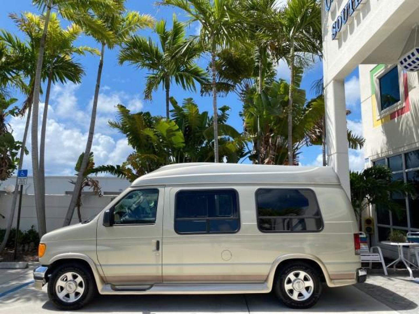 2004 Gold Ash Metallic /Medium Pebble Ford Econoline HIGH TOP CONVERSION VAN 1 OWNER LOW MILES 37,883 (1FDRE14L64H) with an 5.4L SOHC EFI V8 Triton Engine engine, Automatic transmission, located at 4701 North Dixie Hwy, Pompano Beach, FL, 33064, (954) 422-2889, 26.240938, -80.123474 - OUR WEBPAGE FLORIDACARS1.COM HAS OVER 100 PHOTOS AND FREE CARFAX LINK 2004 Ford Econoline E150 HIGH TOP CONVERSION VAN SHERROD 1 OWNER Van 5.4L V8 F SOHC 16V Gasoline 17 MPG Rear Wheel Drive Features ABS Brakes Air Conditioning Alloy Wheels AM/FM Stereo Automatic Transmission CD Audio Conversion Van- Photo#4