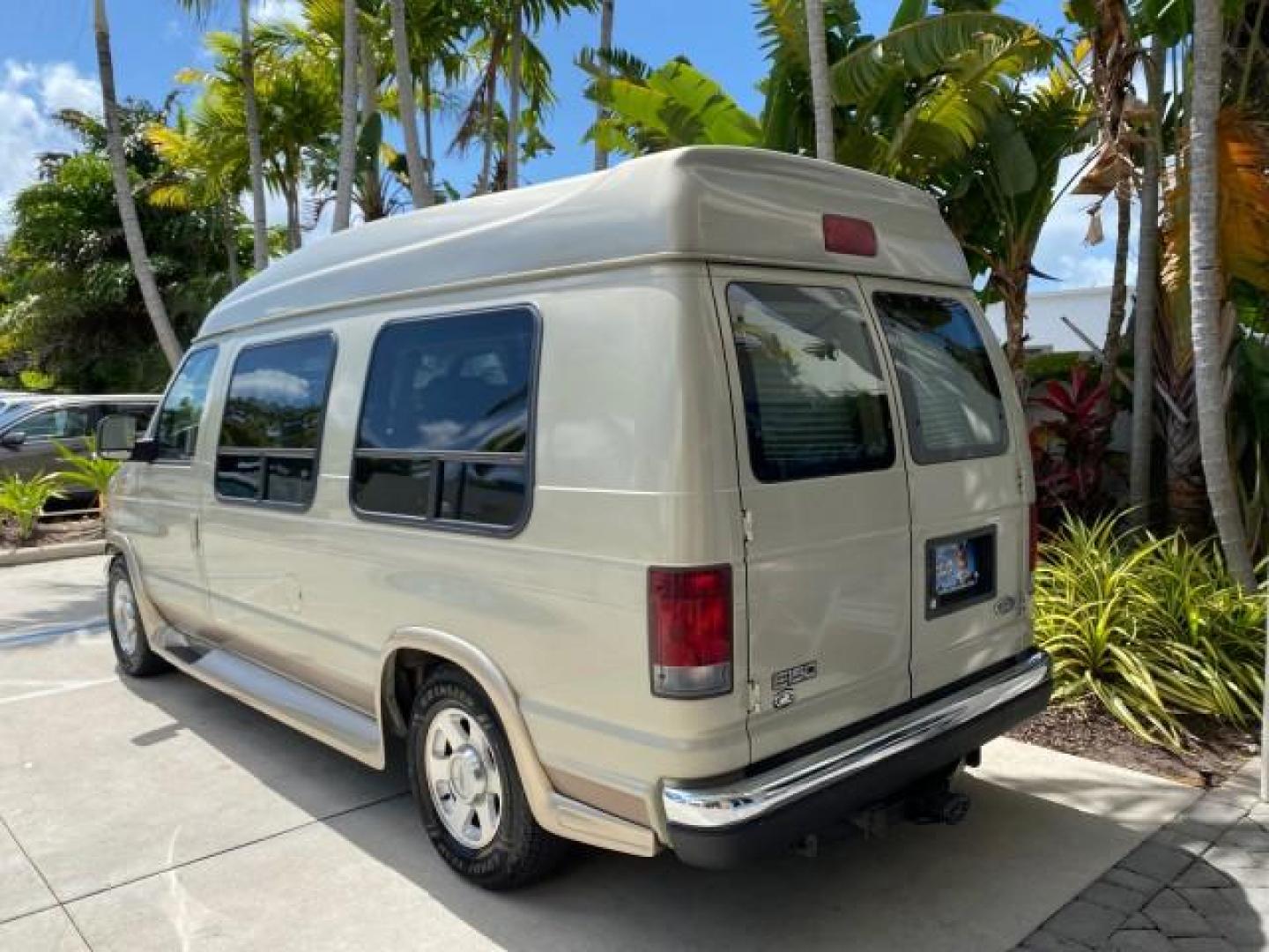2004 Gold Ash Metallic /Medium Pebble Ford Econoline HIGH TOP CONVERSION VAN 1 OWNER LOW MILES 37,883 (1FDRE14L64H) with an 5.4L SOHC EFI V8 Triton Engine engine, Automatic transmission, located at 4701 North Dixie Hwy, Pompano Beach, FL, 33064, (954) 422-2889, 26.240938, -80.123474 - OUR WEBPAGE FLORIDACARS1.COM HAS OVER 100 PHOTOS AND FREE CARFAX LINK 2004 Ford Econoline E150 HIGH TOP CONVERSION VAN SHERROD 1 OWNER Van 5.4L V8 F SOHC 16V Gasoline 17 MPG Rear Wheel Drive Features ABS Brakes Air Conditioning Alloy Wheels AM/FM Stereo Automatic Transmission CD Audio Conversion Van- Photo#5