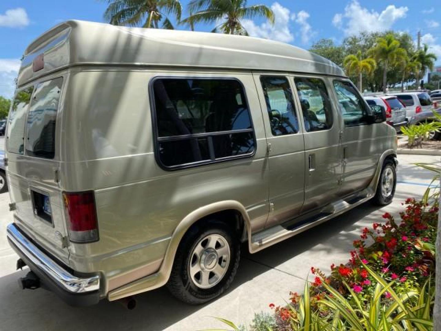 2004 Gold Ash Metallic /Medium Pebble Ford Econoline HIGH TOP CONVERSION VAN 1 OWNER LOW MILES 37,883 (1FDRE14L64H) with an 5.4L SOHC EFI V8 Triton Engine engine, Automatic transmission, located at 4701 North Dixie Hwy, Pompano Beach, FL, 33064, (954) 422-2889, 26.240938, -80.123474 - OUR WEBPAGE FLORIDACARS1.COM HAS OVER 100 PHOTOS AND FREE CARFAX LINK 2004 Ford Econoline E150 HIGH TOP CONVERSION VAN SHERROD 1 OWNER Van 5.4L V8 F SOHC 16V Gasoline 17 MPG Rear Wheel Drive Features ABS Brakes Air Conditioning Alloy Wheels AM/FM Stereo Automatic Transmission CD Audio Conversion Van- Photo#7