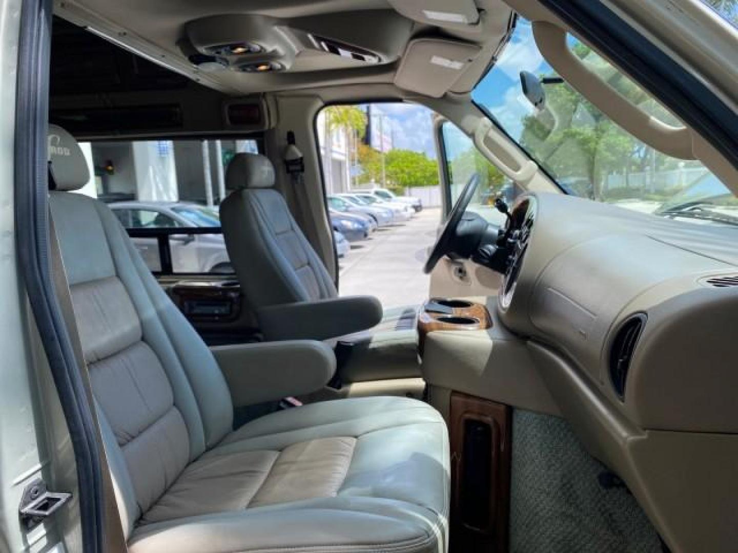 2004 Gold Ash Metallic /Medium Pebble Ford Econoline HIGH TOP CONVERSION VAN 1 OWNER LOW MILES 37,883 (1FDRE14L64H) with an 5.4L SOHC EFI V8 Triton Engine engine, Automatic transmission, located at 4701 North Dixie Hwy, Pompano Beach, FL, 33064, (954) 422-2889, 26.240938, -80.123474 - OUR WEBPAGE FLORIDACARS1.COM HAS OVER 100 PHOTOS AND FREE CARFAX LINK 2004 Ford Econoline E150 HIGH TOP CONVERSION VAN SHERROD 1 OWNER Van 5.4L V8 F SOHC 16V Gasoline 17 MPG Rear Wheel Drive Features ABS Brakes Air Conditioning Alloy Wheels AM/FM Stereo Automatic Transmission CD Audio Conversion Van- Photo#12