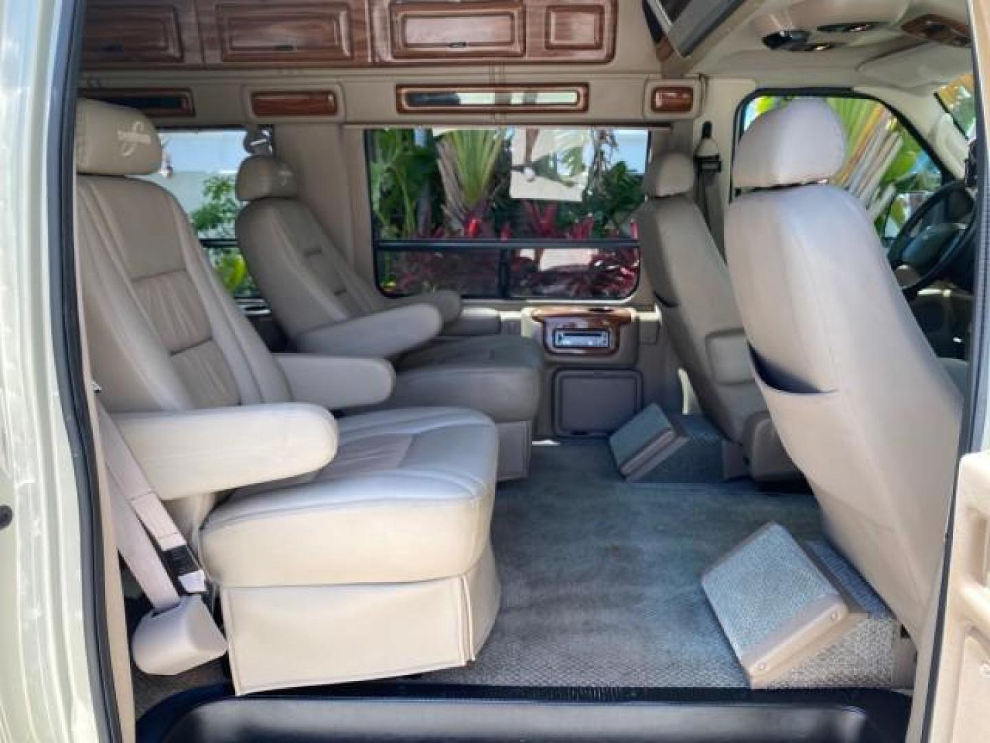 2004 Gold Ash Metallic /Medium Pebble Ford Econoline HIGH TOP CONVERSION VAN 1 OWNER LOW MILES 37,883 (1FDRE14L64H) with an 5.4L SOHC EFI V8 Triton Engine engine, Automatic transmission, located at 4701 North Dixie Hwy, Pompano Beach, FL, 33064, (954) 422-2889, 26.240938, -80.123474 - OUR WEBPAGE FLORIDACARS1.COM HAS OVER 100 PHOTOS AND FREE CARFAX LINK 2004 Ford Econoline E150 HIGH TOP CONVERSION VAN SHERROD 1 OWNER Van 5.4L V8 F SOHC 16V Gasoline 17 MPG Rear Wheel Drive Features ABS Brakes Air Conditioning Alloy Wheels AM/FM Stereo Automatic Transmission CD Audio Conversion Van- Photo#14
