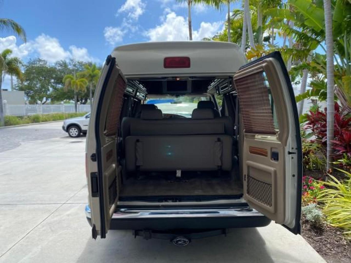 2004 Gold Ash Metallic /Medium Pebble Ford Econoline HIGH TOP CONVERSION VAN 1 OWNER LOW MILES 37,883 (1FDRE14L64H) with an 5.4L SOHC EFI V8 Triton Engine engine, Automatic transmission, located at 4701 North Dixie Hwy, Pompano Beach, FL, 33064, (954) 422-2889, 26.240938, -80.123474 - OUR WEBPAGE FLORIDACARS1.COM HAS OVER 100 PHOTOS AND FREE CARFAX LINK 2004 Ford Econoline E150 HIGH TOP CONVERSION VAN SHERROD 1 OWNER Van 5.4L V8 F SOHC 16V Gasoline 17 MPG Rear Wheel Drive Features ABS Brakes Air Conditioning Alloy Wheels AM/FM Stereo Automatic Transmission CD Audio Conversion Van- Photo#15