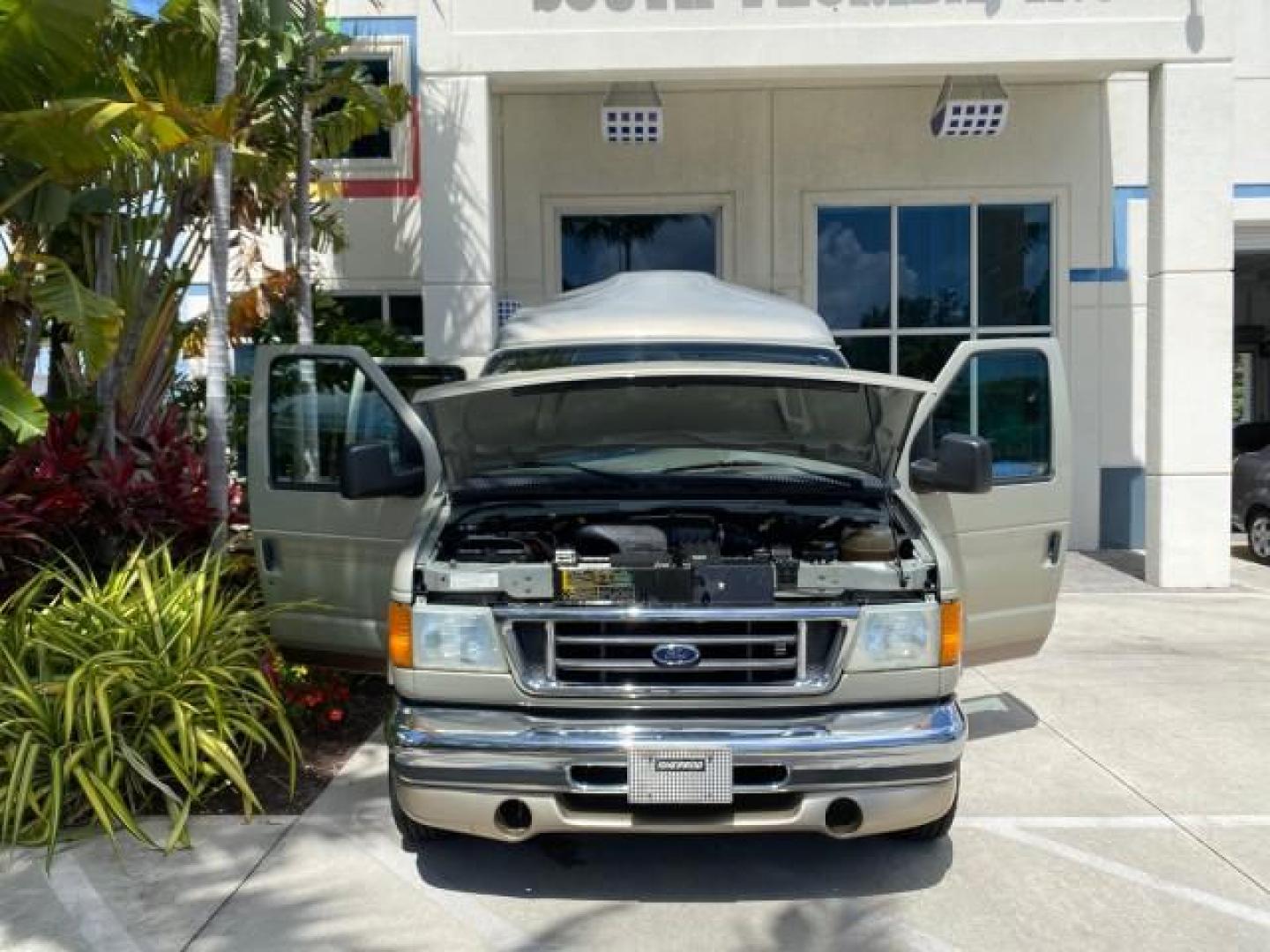2004 Gold Ash Metallic /Medium Pebble Ford Econoline HIGH TOP CONVERSION VAN 1 OWNER LOW MILES 37,883 (1FDRE14L64H) with an 5.4L SOHC EFI V8 Triton Engine engine, Automatic transmission, located at 4701 North Dixie Hwy, Pompano Beach, FL, 33064, (954) 422-2889, 26.240938, -80.123474 - OUR WEBPAGE FLORIDACARS1.COM HAS OVER 100 PHOTOS AND FREE CARFAX LINK 2004 Ford Econoline E150 HIGH TOP CONVERSION VAN SHERROD 1 OWNER Van 5.4L V8 F SOHC 16V Gasoline 17 MPG Rear Wheel Drive Features ABS Brakes Air Conditioning Alloy Wheels AM/FM Stereo Automatic Transmission CD Audio Conversion Van- Photo#16