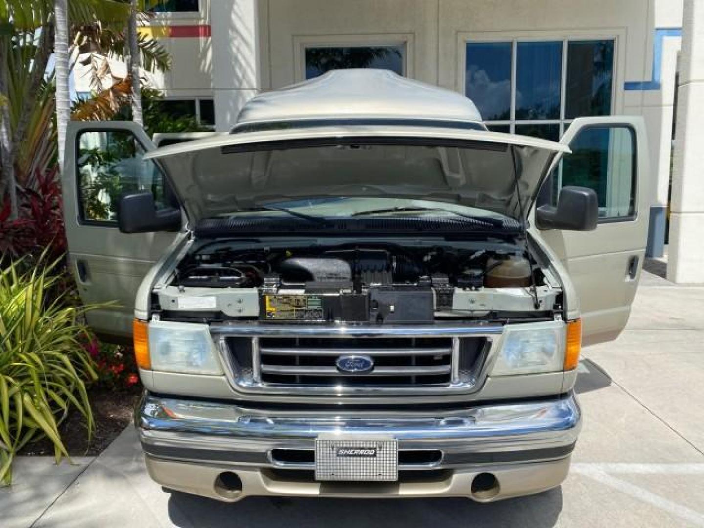 2004 Gold Ash Metallic /Medium Pebble Ford Econoline HIGH TOP CONVERSION VAN 1 OWNER LOW MILES 37,883 (1FDRE14L64H) with an 5.4L SOHC EFI V8 Triton Engine engine, Automatic transmission, located at 4701 North Dixie Hwy, Pompano Beach, FL, 33064, (954) 422-2889, 26.240938, -80.123474 - OUR WEBPAGE FLORIDACARS1.COM HAS OVER 100 PHOTOS AND FREE CARFAX LINK 2004 Ford Econoline E150 HIGH TOP CONVERSION VAN SHERROD 1 OWNER Van 5.4L V8 F SOHC 16V Gasoline 17 MPG Rear Wheel Drive Features ABS Brakes Air Conditioning Alloy Wheels AM/FM Stereo Automatic Transmission CD Audio Conversion Van- Photo#17