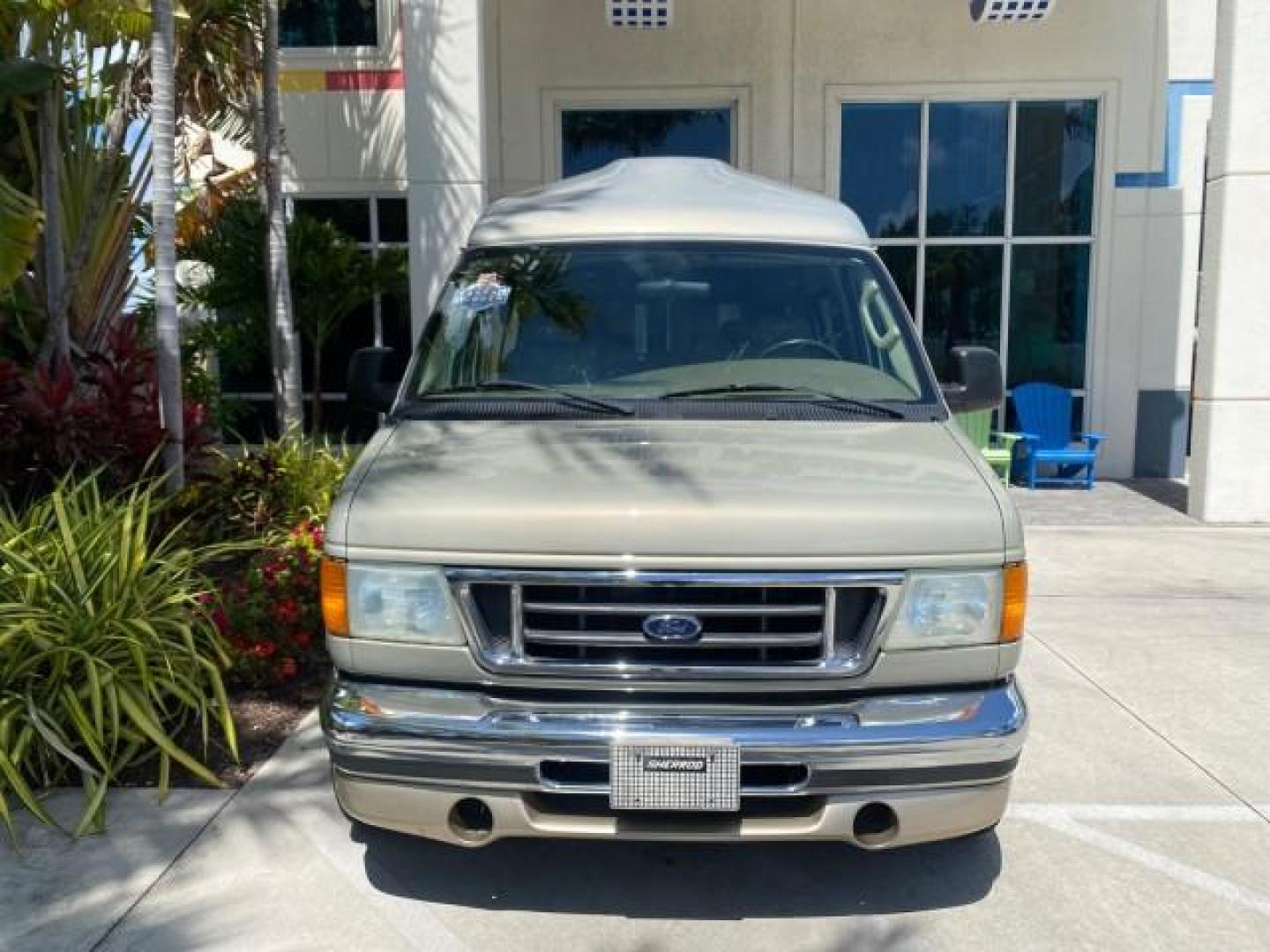 2004 Gold Ash Metallic /Medium Pebble Ford Econoline HIGH TOP CONVERSION VAN 1 OWNER LOW MILES 37,883 (1FDRE14L64H) with an 5.4L SOHC EFI V8 Triton Engine engine, Automatic transmission, located at 4701 North Dixie Hwy, Pompano Beach, FL, 33064, (954) 422-2889, 26.240938, -80.123474 - OUR WEBPAGE FLORIDACARS1.COM HAS OVER 100 PHOTOS AND FREE CARFAX LINK 2004 Ford Econoline E150 HIGH TOP CONVERSION VAN SHERROD 1 OWNER Van 5.4L V8 F SOHC 16V Gasoline 17 MPG Rear Wheel Drive Features ABS Brakes Air Conditioning Alloy Wheels AM/FM Stereo Automatic Transmission CD Audio Conversion Van- Photo#26
