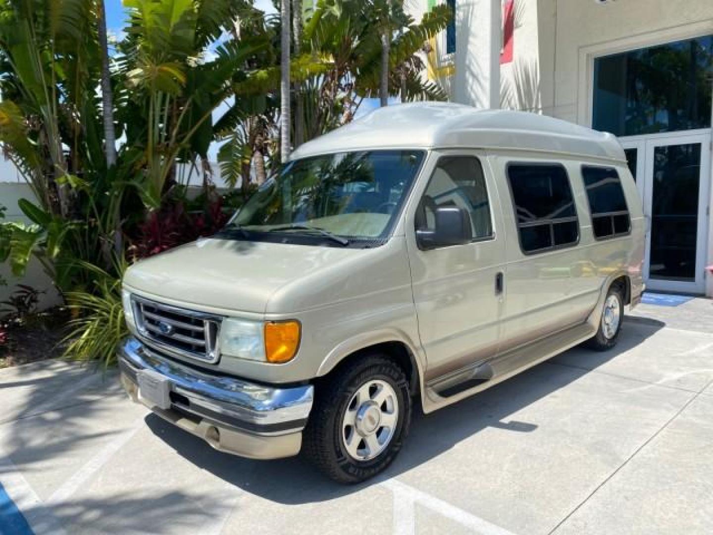 2004 Gold Ash Metallic /Medium Pebble Ford Econoline HIGH TOP CONVERSION VAN 1 OWNER LOW MILES 37,883 (1FDRE14L64H) with an 5.4L SOHC EFI V8 Triton Engine engine, Automatic transmission, located at 4701 North Dixie Hwy, Pompano Beach, FL, 33064, (954) 422-2889, 26.240938, -80.123474 - OUR WEBPAGE FLORIDACARS1.COM HAS OVER 100 PHOTOS AND FREE CARFAX LINK 2004 Ford Econoline E150 HIGH TOP CONVERSION VAN SHERROD 1 OWNER Van 5.4L V8 F SOHC 16V Gasoline 17 MPG Rear Wheel Drive Features ABS Brakes Air Conditioning Alloy Wheels AM/FM Stereo Automatic Transmission CD Audio Conversion Van- Photo#28