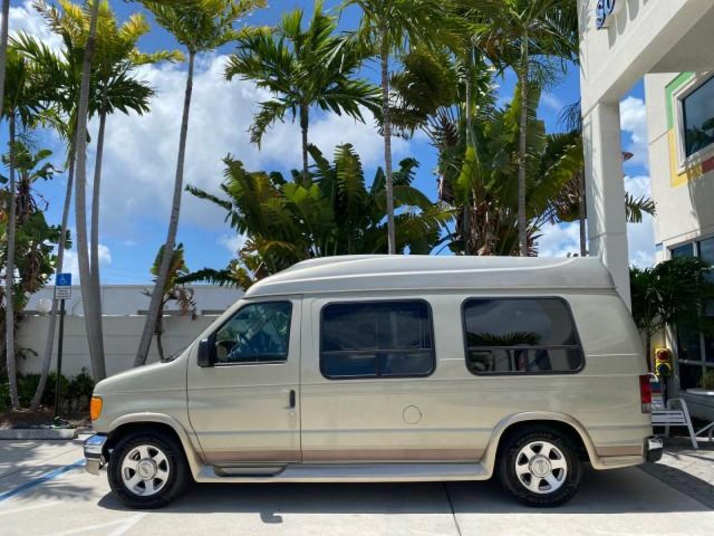 2004 Gold Ash Metallic /Medium Pebble Ford Econoline HIGH TOP CONVERSION VAN 1 OWNER LOW MILES 37,883 (1FDRE14L64H) with an 5.4L SOHC EFI V8 Triton Engine engine, Automatic transmission, located at 4701 North Dixie Hwy, Pompano Beach, FL, 33064, (954) 422-2889, 26.240938, -80.123474 - OUR WEBPAGE FLORIDACARS1.COM HAS OVER 100 PHOTOS AND FREE CARFAX LINK 2004 Ford Econoline E150 HIGH TOP CONVERSION VAN SHERROD 1 OWNER Van 5.4L V8 F SOHC 16V Gasoline 17 MPG Rear Wheel Drive Features ABS Brakes Air Conditioning Alloy Wheels AM/FM Stereo Automatic Transmission CD Audio Conversion Van- Photo#30