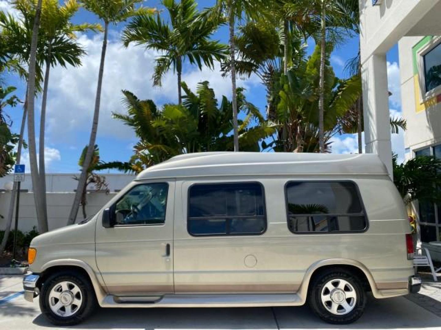 2004 Gold Ash Metallic /Medium Pebble Ford Econoline HIGH TOP CONVERSION VAN 1 OWNER LOW MILES 37,883 (1FDRE14L64H) with an 5.4L SOHC EFI V8 Triton Engine engine, Automatic transmission, located at 4701 North Dixie Hwy, Pompano Beach, FL, 33064, (954) 422-2889, 26.240938, -80.123474 - OUR WEBPAGE FLORIDACARS1.COM HAS OVER 100 PHOTOS AND FREE CARFAX LINK 2004 Ford Econoline E150 HIGH TOP CONVERSION VAN SHERROD 1 OWNER Van 5.4L V8 F SOHC 16V Gasoline 17 MPG Rear Wheel Drive Features ABS Brakes Air Conditioning Alloy Wheels AM/FM Stereo Automatic Transmission CD Audio Conversion Van- Photo#31