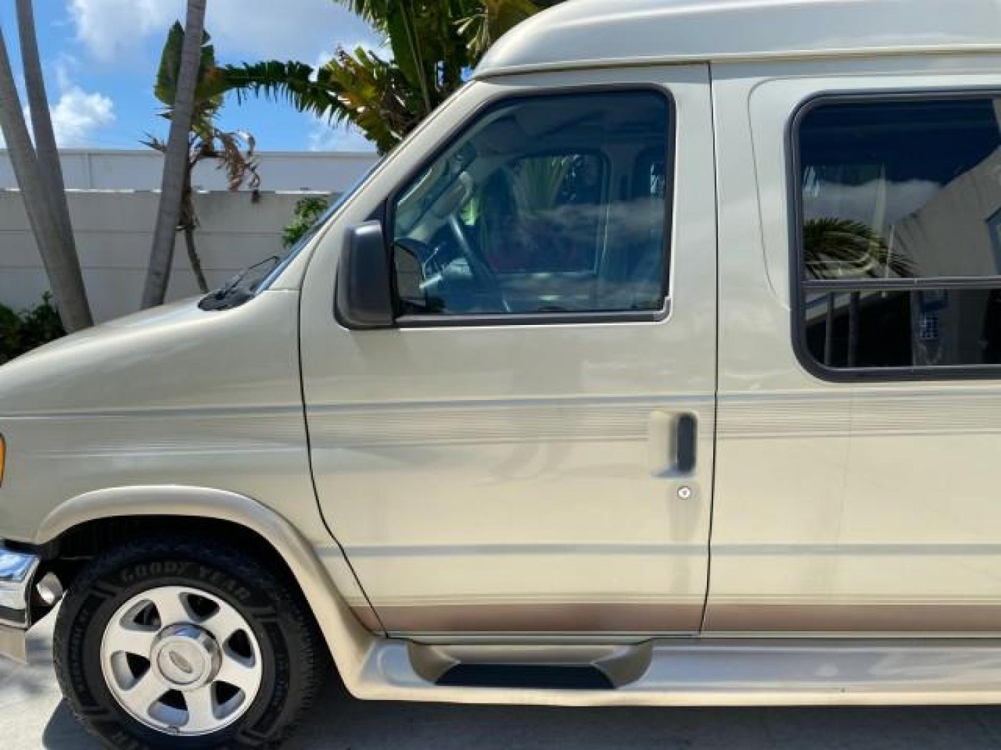 2004 Gold Ash Metallic /Medium Pebble Ford Econoline HIGH TOP CONVERSION VAN 1 OWNER LOW MILES 37,883 (1FDRE14L64H) with an 5.4L SOHC EFI V8 Triton Engine engine, Automatic transmission, located at 4701 North Dixie Hwy, Pompano Beach, FL, 33064, (954) 422-2889, 26.240938, -80.123474 - OUR WEBPAGE FLORIDACARS1.COM HAS OVER 100 PHOTOS AND FREE CARFAX LINK 2004 Ford Econoline E150 HIGH TOP CONVERSION VAN SHERROD 1 OWNER Van 5.4L V8 F SOHC 16V Gasoline 17 MPG Rear Wheel Drive Features ABS Brakes Air Conditioning Alloy Wheels AM/FM Stereo Automatic Transmission CD Audio Conversion Van- Photo#37