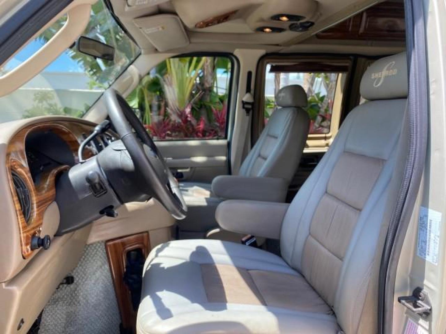 2004 Gold Ash Metallic /Medium Pebble Ford Econoline HIGH TOP CONVERSION VAN 1 OWNER LOW MILES 37,883 (1FDRE14L64H) with an 5.4L SOHC EFI V8 Triton Engine engine, Automatic transmission, located at 4701 North Dixie Hwy, Pompano Beach, FL, 33064, (954) 422-2889, 26.240938, -80.123474 - OUR WEBPAGE FLORIDACARS1.COM HAS OVER 100 PHOTOS AND FREE CARFAX LINK 2004 Ford Econoline E150 HIGH TOP CONVERSION VAN SHERROD 1 OWNER Van 5.4L V8 F SOHC 16V Gasoline 17 MPG Rear Wheel Drive Features ABS Brakes Air Conditioning Alloy Wheels AM/FM Stereo Automatic Transmission CD Audio Conversion Van- Photo#44