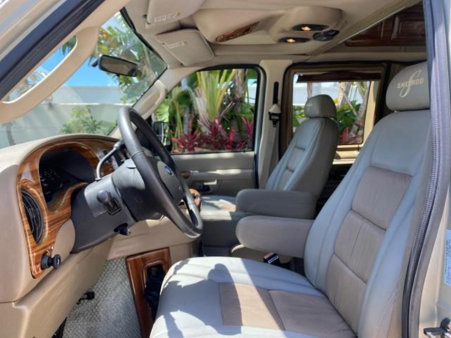 2004 Gold Ash Metallic /Medium Pebble Ford Econoline HIGH TOP CONVERSION VAN 1 OWNER LOW MILES 37,883 (1FDRE14L64H) with an 5.4L SOHC EFI V8 Triton Engine engine, Automatic transmission, located at 4701 North Dixie Hwy, Pompano Beach, FL, 33064, (954) 422-2889, 26.240938, -80.123474 - OUR WEBPAGE FLORIDACARS1.COM HAS OVER 100 PHOTOS AND FREE CARFAX LINK 2004 Ford Econoline E150 HIGH TOP CONVERSION VAN SHERROD 1 OWNER Van 5.4L V8 F SOHC 16V Gasoline 17 MPG Rear Wheel Drive Features ABS Brakes Air Conditioning Alloy Wheels AM/FM Stereo Automatic Transmission CD Audio Conversion Van- Photo#45