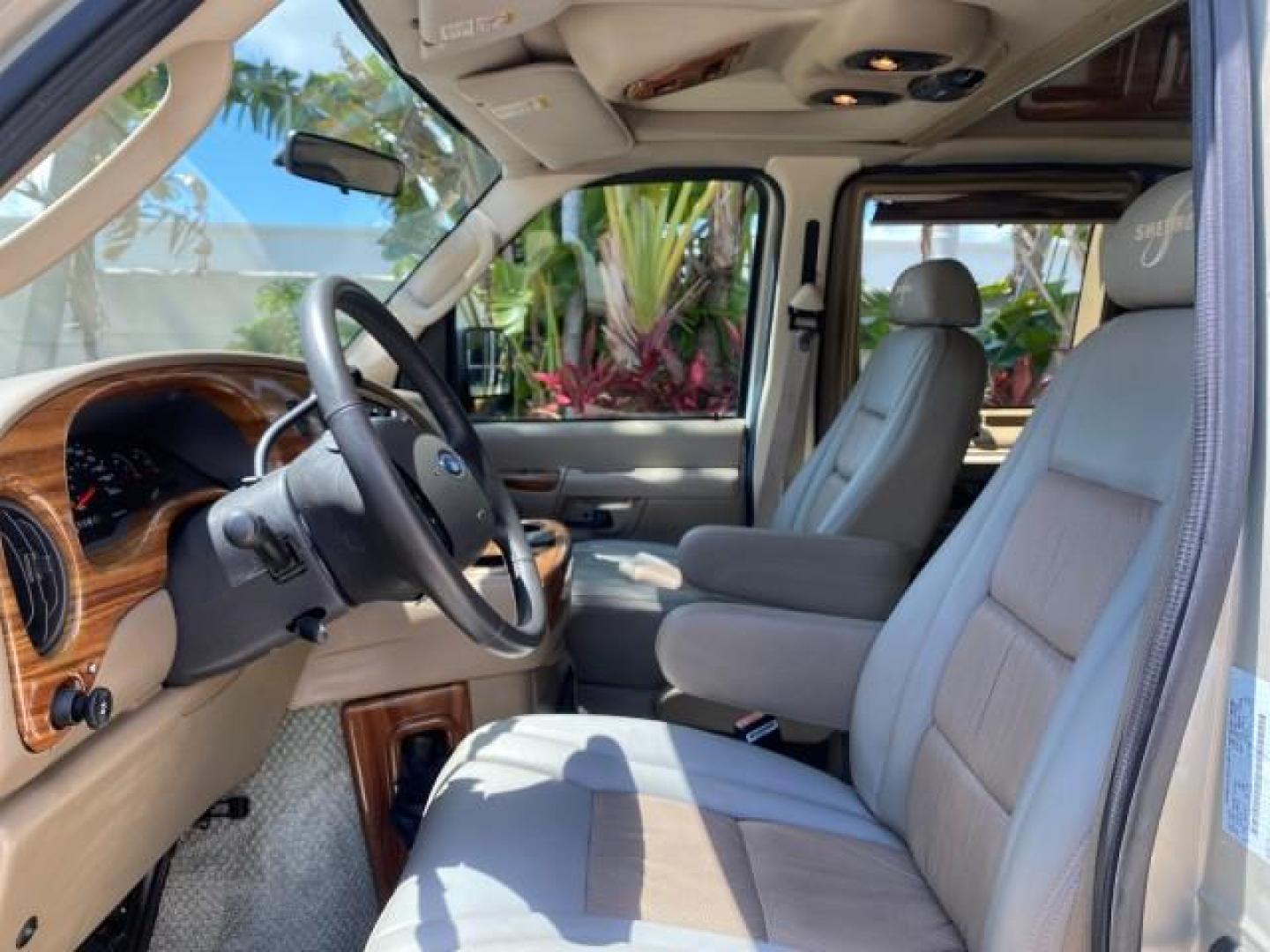 2004 Gold Ash Metallic /Medium Pebble Ford Econoline HIGH TOP CONVERSION VAN 1 OWNER LOW MILES 37,883 (1FDRE14L64H) with an 5.4L SOHC EFI V8 Triton Engine engine, Automatic transmission, located at 4701 North Dixie Hwy, Pompano Beach, FL, 33064, (954) 422-2889, 26.240938, -80.123474 - OUR WEBPAGE FLORIDACARS1.COM HAS OVER 100 PHOTOS AND FREE CARFAX LINK 2004 Ford Econoline E150 HIGH TOP CONVERSION VAN SHERROD 1 OWNER Van 5.4L V8 F SOHC 16V Gasoline 17 MPG Rear Wheel Drive Features ABS Brakes Air Conditioning Alloy Wheels AM/FM Stereo Automatic Transmission CD Audio Conversion Van- Photo#46