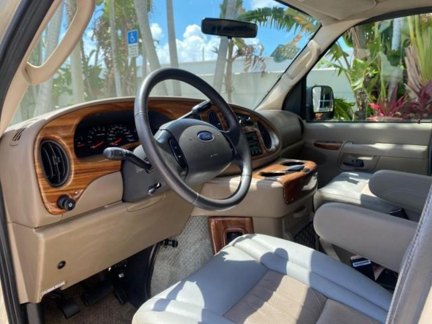 2004 Gold Ash Metallic /Medium Pebble Ford Econoline HIGH TOP CONVERSION VAN 1 OWNER LOW MILES 37,883 (1FDRE14L64H) with an 5.4L SOHC EFI V8 Triton Engine engine, Automatic transmission, located at 4701 North Dixie Hwy, Pompano Beach, FL, 33064, (954) 422-2889, 26.240938, -80.123474 - OUR WEBPAGE FLORIDACARS1.COM HAS OVER 100 PHOTOS AND FREE CARFAX LINK 2004 Ford Econoline E150 HIGH TOP CONVERSION VAN SHERROD 1 OWNER Van 5.4L V8 F SOHC 16V Gasoline 17 MPG Rear Wheel Drive Features ABS Brakes Air Conditioning Alloy Wheels AM/FM Stereo Automatic Transmission CD Audio Conversion Van- Photo#48