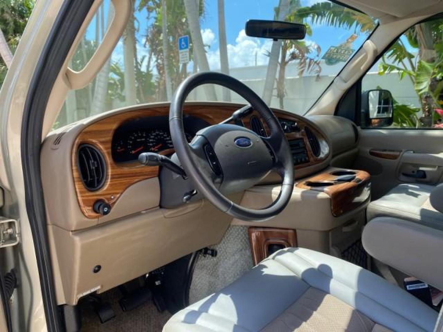 2004 Gold Ash Metallic /Medium Pebble Ford Econoline HIGH TOP CONVERSION VAN 1 OWNER LOW MILES 37,883 (1FDRE14L64H) with an 5.4L SOHC EFI V8 Triton Engine engine, Automatic transmission, located at 4701 North Dixie Hwy, Pompano Beach, FL, 33064, (954) 422-2889, 26.240938, -80.123474 - OUR WEBPAGE FLORIDACARS1.COM HAS OVER 100 PHOTOS AND FREE CARFAX LINK 2004 Ford Econoline E150 HIGH TOP CONVERSION VAN SHERROD 1 OWNER Van 5.4L V8 F SOHC 16V Gasoline 17 MPG Rear Wheel Drive Features ABS Brakes Air Conditioning Alloy Wheels AM/FM Stereo Automatic Transmission CD Audio Conversion Van- Photo#49