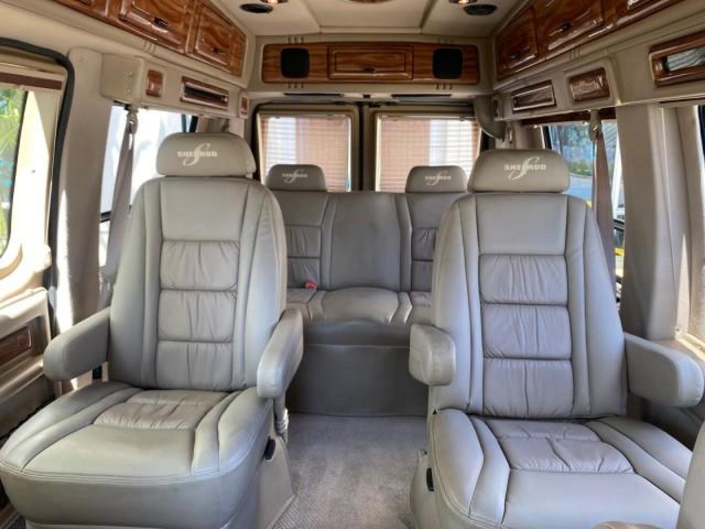 2004 Gold Ash Metallic /Medium Pebble Ford Econoline HIGH TOP CONVERSION VAN 1 OWNER LOW MILES 37,883 (1FDRE14L64H) with an 5.4L SOHC EFI V8 Triton Engine engine, Automatic transmission, located at 4701 North Dixie Hwy, Pompano Beach, FL, 33064, (954) 422-2889, 26.240938, -80.123474 - OUR WEBPAGE FLORIDACARS1.COM HAS OVER 100 PHOTOS AND FREE CARFAX LINK 2004 Ford Econoline E150 HIGH TOP CONVERSION VAN SHERROD 1 OWNER Van 5.4L V8 F SOHC 16V Gasoline 17 MPG Rear Wheel Drive Features ABS Brakes Air Conditioning Alloy Wheels AM/FM Stereo Automatic Transmission CD Audio Conversion Van- Photo#73