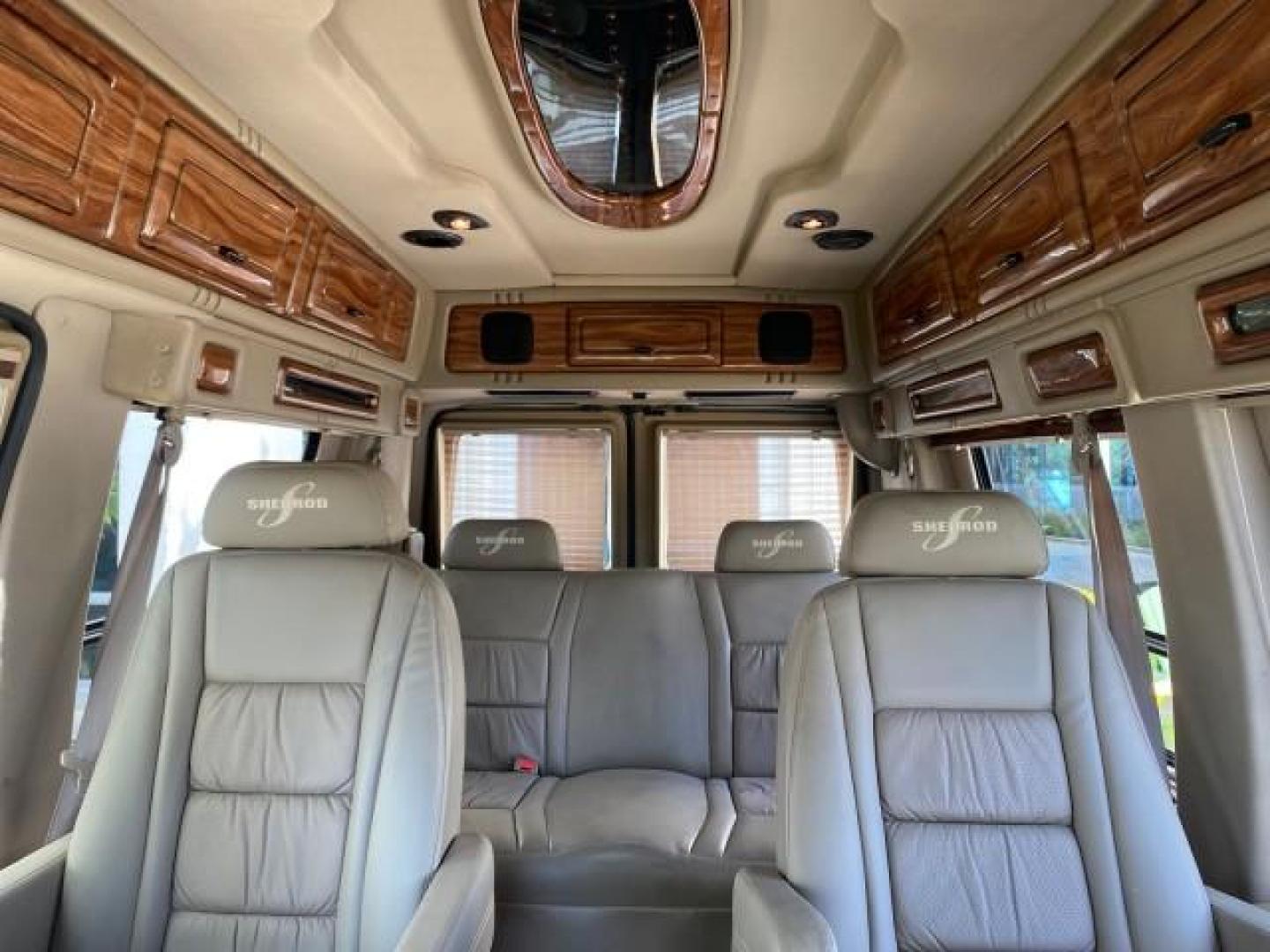 2004 Gold Ash Metallic /Medium Pebble Ford Econoline HIGH TOP CONVERSION VAN 1 OWNER LOW MILES 37,883 (1FDRE14L64H) with an 5.4L SOHC EFI V8 Triton Engine engine, Automatic transmission, located at 4701 North Dixie Hwy, Pompano Beach, FL, 33064, (954) 422-2889, 26.240938, -80.123474 - OUR WEBPAGE FLORIDACARS1.COM HAS OVER 100 PHOTOS AND FREE CARFAX LINK 2004 Ford Econoline E150 HIGH TOP CONVERSION VAN SHERROD 1 OWNER Van 5.4L V8 F SOHC 16V Gasoline 17 MPG Rear Wheel Drive Features ABS Brakes Air Conditioning Alloy Wheels AM/FM Stereo Automatic Transmission CD Audio Conversion Van- Photo#74