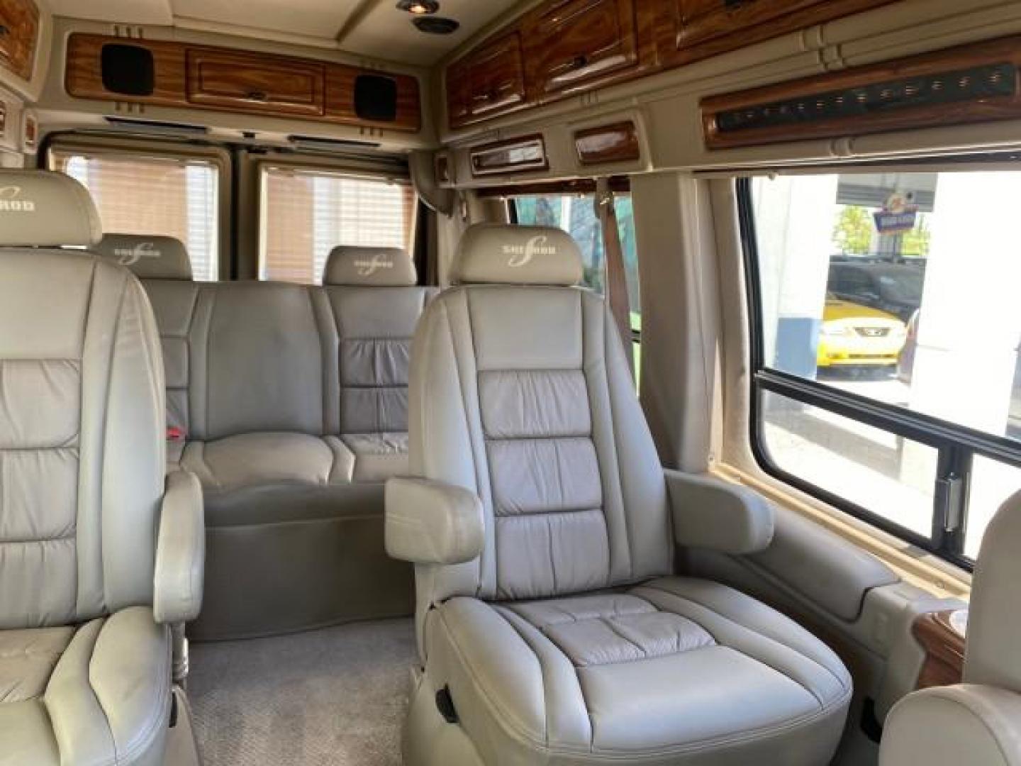 2004 Gold Ash Metallic /Medium Pebble Ford Econoline HIGH TOP CONVERSION VAN 1 OWNER LOW MILES 37,883 (1FDRE14L64H) with an 5.4L SOHC EFI V8 Triton Engine engine, Automatic transmission, located at 4701 North Dixie Hwy, Pompano Beach, FL, 33064, (954) 422-2889, 26.240938, -80.123474 - OUR WEBPAGE FLORIDACARS1.COM HAS OVER 100 PHOTOS AND FREE CARFAX LINK 2004 Ford Econoline E150 HIGH TOP CONVERSION VAN SHERROD 1 OWNER Van 5.4L V8 F SOHC 16V Gasoline 17 MPG Rear Wheel Drive Features ABS Brakes Air Conditioning Alloy Wheels AM/FM Stereo Automatic Transmission CD Audio Conversion Van- Photo#75