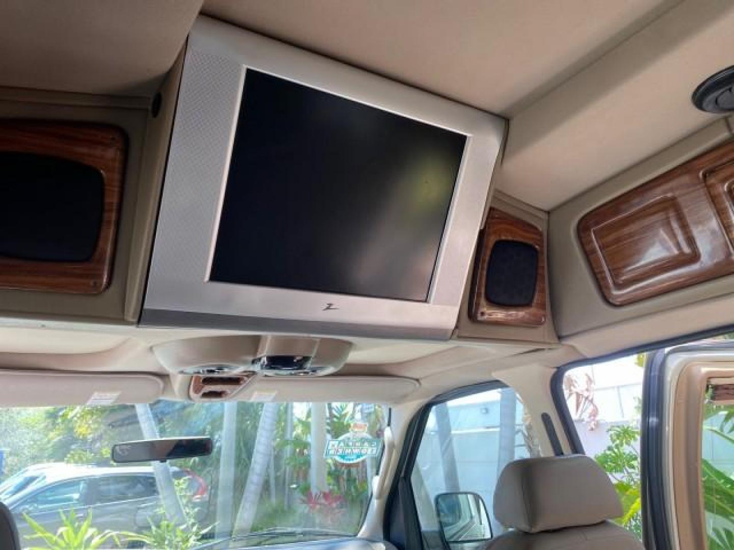 2004 Gold Ash Metallic /Medium Pebble Ford Econoline HIGH TOP CONVERSION VAN 1 OWNER LOW MILES 37,883 (1FDRE14L64H) with an 5.4L SOHC EFI V8 Triton Engine engine, Automatic transmission, located at 4701 North Dixie Hwy, Pompano Beach, FL, 33064, (954) 422-2889, 26.240938, -80.123474 - OUR WEBPAGE FLORIDACARS1.COM HAS OVER 100 PHOTOS AND FREE CARFAX LINK 2004 Ford Econoline E150 HIGH TOP CONVERSION VAN SHERROD 1 OWNER Van 5.4L V8 F SOHC 16V Gasoline 17 MPG Rear Wheel Drive Features ABS Brakes Air Conditioning Alloy Wheels AM/FM Stereo Automatic Transmission CD Audio Conversion Van- Photo#78