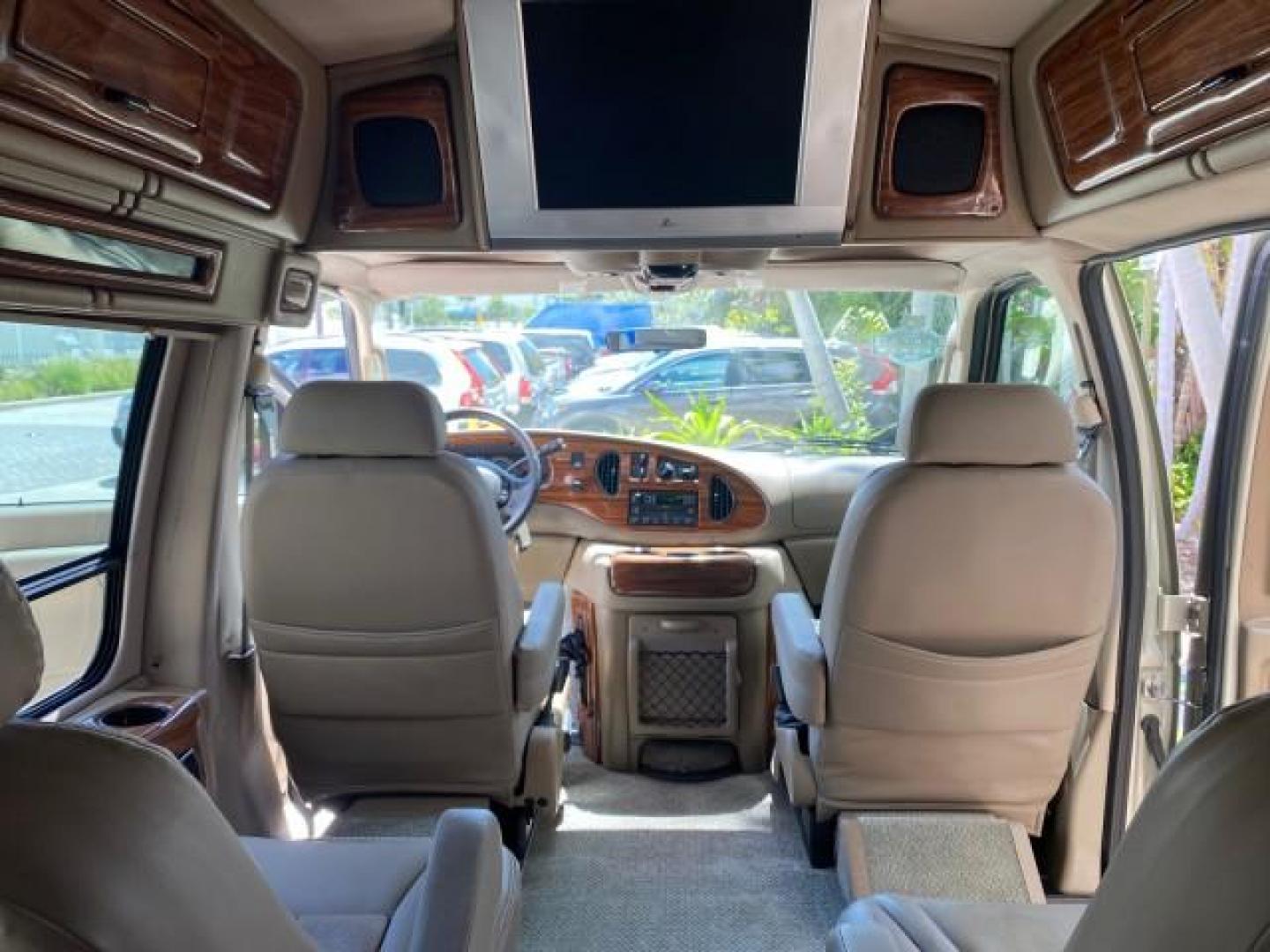 2004 Gold Ash Metallic /Medium Pebble Ford Econoline HIGH TOP CONVERSION VAN 1 OWNER LOW MILES 37,883 (1FDRE14L64H) with an 5.4L SOHC EFI V8 Triton Engine engine, Automatic transmission, located at 4701 North Dixie Hwy, Pompano Beach, FL, 33064, (954) 422-2889, 26.240938, -80.123474 - OUR WEBPAGE FLORIDACARS1.COM HAS OVER 100 PHOTOS AND FREE CARFAX LINK 2004 Ford Econoline E150 HIGH TOP CONVERSION VAN SHERROD 1 OWNER Van 5.4L V8 F SOHC 16V Gasoline 17 MPG Rear Wheel Drive Features ABS Brakes Air Conditioning Alloy Wheels AM/FM Stereo Automatic Transmission CD Audio Conversion Van- Photo#80