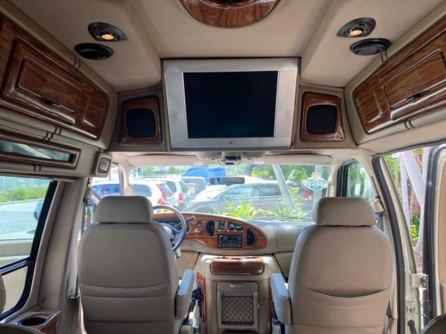 2004 Gold Ash Metallic /Medium Pebble Ford Econoline HIGH TOP CONVERSION VAN 1 OWNER LOW MILES 37,883 (1FDRE14L64H) with an 5.4L SOHC EFI V8 Triton Engine engine, Automatic transmission, located at 4701 North Dixie Hwy, Pompano Beach, FL, 33064, (954) 422-2889, 26.240938, -80.123474 - OUR WEBPAGE FLORIDACARS1.COM HAS OVER 100 PHOTOS AND FREE CARFAX LINK 2004 Ford Econoline E150 HIGH TOP CONVERSION VAN SHERROD 1 OWNER Van 5.4L V8 F SOHC 16V Gasoline 17 MPG Rear Wheel Drive Features ABS Brakes Air Conditioning Alloy Wheels AM/FM Stereo Automatic Transmission CD Audio Conversion Van- Photo#81