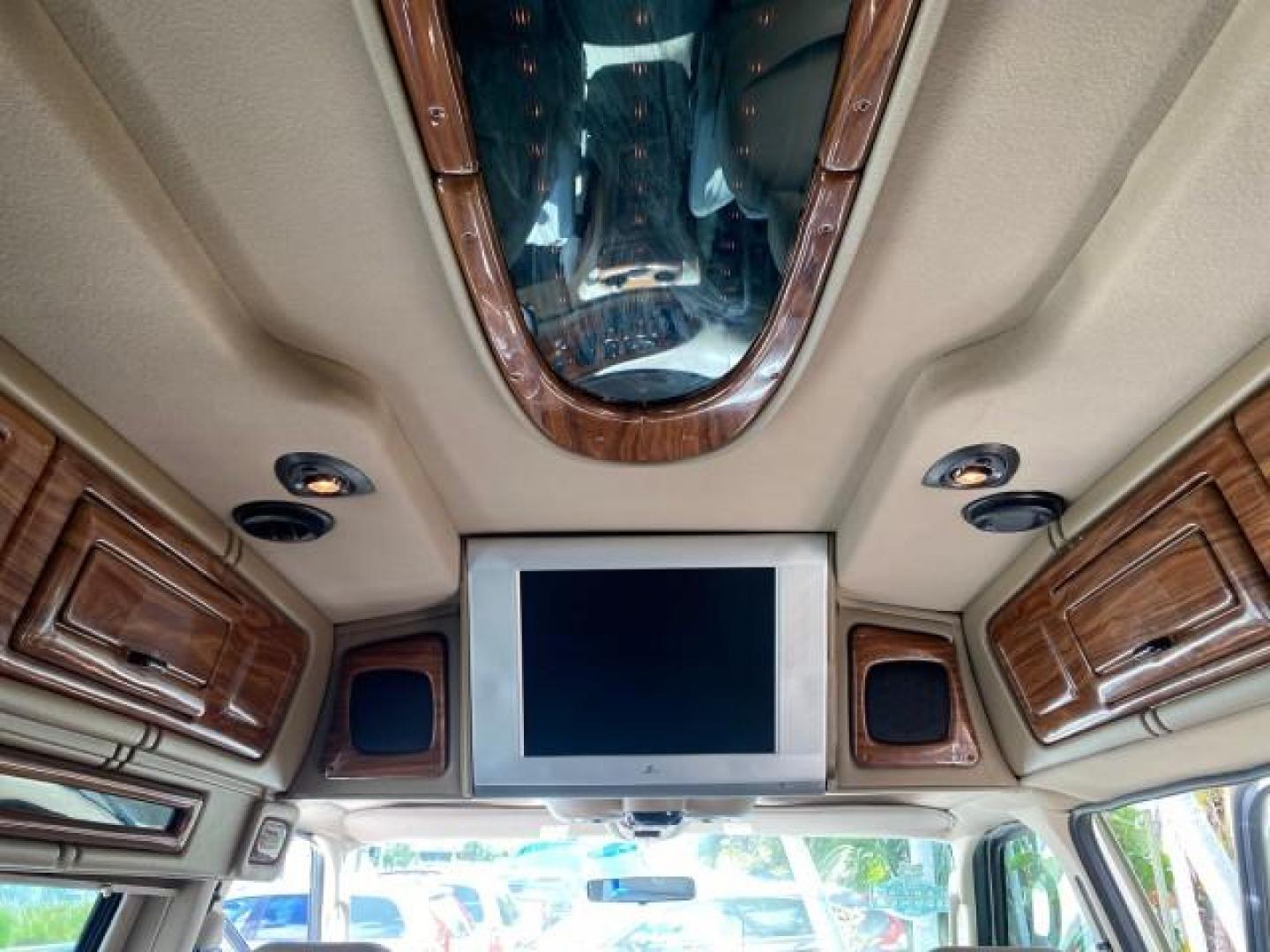 2004 Gold Ash Metallic /Medium Pebble Ford Econoline HIGH TOP CONVERSION VAN 1 OWNER LOW MILES 37,883 (1FDRE14L64H) with an 5.4L SOHC EFI V8 Triton Engine engine, Automatic transmission, located at 4701 North Dixie Hwy, Pompano Beach, FL, 33064, (954) 422-2889, 26.240938, -80.123474 - OUR WEBPAGE FLORIDACARS1.COM HAS OVER 100 PHOTOS AND FREE CARFAX LINK 2004 Ford Econoline E150 HIGH TOP CONVERSION VAN SHERROD 1 OWNER Van 5.4L V8 F SOHC 16V Gasoline 17 MPG Rear Wheel Drive Features ABS Brakes Air Conditioning Alloy Wheels AM/FM Stereo Automatic Transmission CD Audio Conversion Van- Photo#82