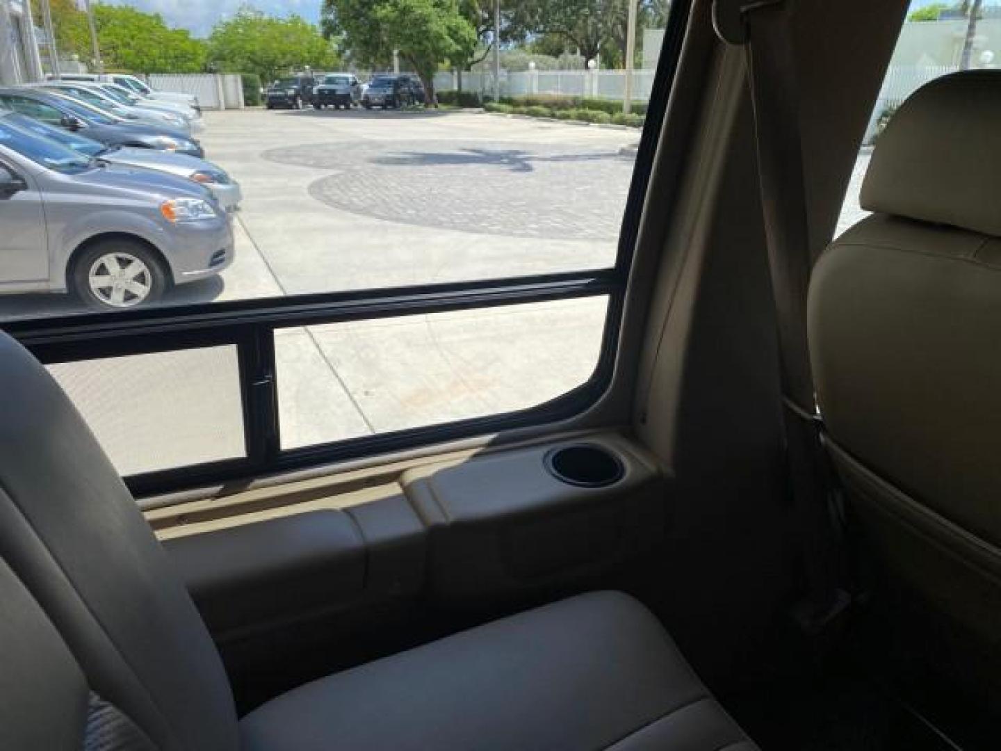 2004 Gold Ash Metallic /Medium Pebble Ford Econoline HIGH TOP CONVERSION VAN 1 OWNER LOW MILES 37,883 (1FDRE14L64H) with an 5.4L SOHC EFI V8 Triton Engine engine, Automatic transmission, located at 4701 North Dixie Hwy, Pompano Beach, FL, 33064, (954) 422-2889, 26.240938, -80.123474 - OUR WEBPAGE FLORIDACARS1.COM HAS OVER 100 PHOTOS AND FREE CARFAX LINK 2004 Ford Econoline E150 HIGH TOP CONVERSION VAN SHERROD 1 OWNER Van 5.4L V8 F SOHC 16V Gasoline 17 MPG Rear Wheel Drive Features ABS Brakes Air Conditioning Alloy Wheels AM/FM Stereo Automatic Transmission CD Audio Conversion Van- Photo#83