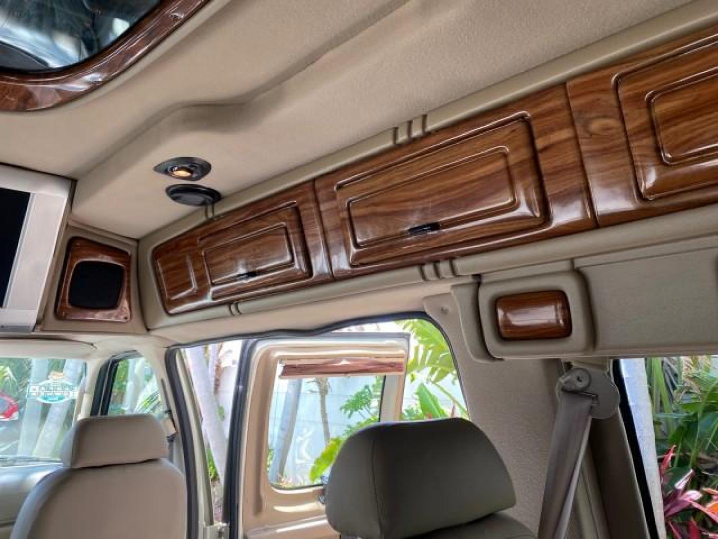 2004 Gold Ash Metallic /Medium Pebble Ford Econoline HIGH TOP CONVERSION VAN 1 OWNER LOW MILES 37,883 (1FDRE14L64H) with an 5.4L SOHC EFI V8 Triton Engine engine, Automatic transmission, located at 4701 North Dixie Hwy, Pompano Beach, FL, 33064, (954) 422-2889, 26.240938, -80.123474 - OUR WEBPAGE FLORIDACARS1.COM HAS OVER 100 PHOTOS AND FREE CARFAX LINK 2004 Ford Econoline E150 HIGH TOP CONVERSION VAN SHERROD 1 OWNER Van 5.4L V8 F SOHC 16V Gasoline 17 MPG Rear Wheel Drive Features ABS Brakes Air Conditioning Alloy Wheels AM/FM Stereo Automatic Transmission CD Audio Conversion Van- Photo#87