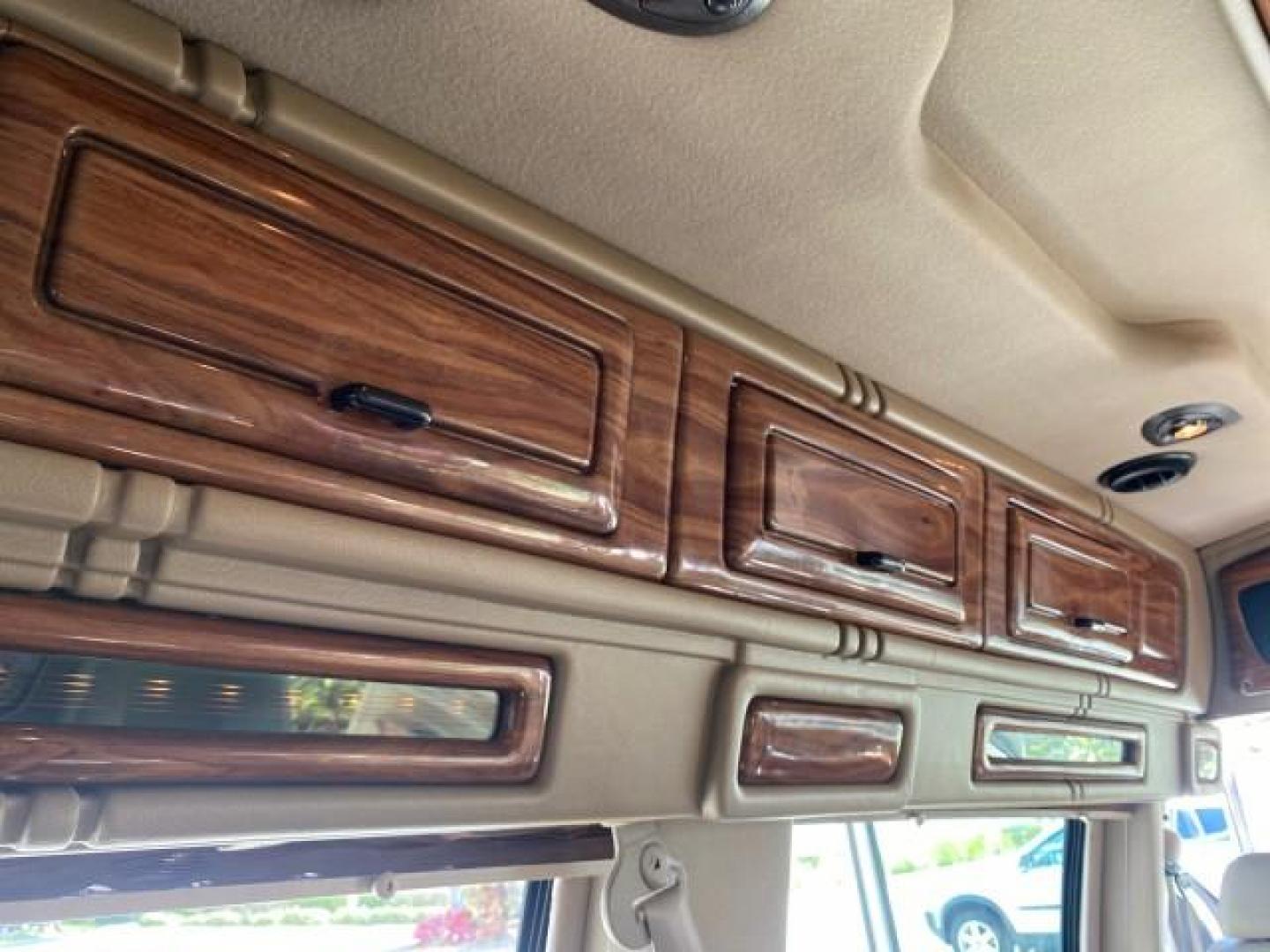 2004 Gold Ash Metallic /Medium Pebble Ford Econoline HIGH TOP CONVERSION VAN 1 OWNER LOW MILES 37,883 (1FDRE14L64H) with an 5.4L SOHC EFI V8 Triton Engine engine, Automatic transmission, located at 4701 North Dixie Hwy, Pompano Beach, FL, 33064, (954) 422-2889, 26.240938, -80.123474 - OUR WEBPAGE FLORIDACARS1.COM HAS OVER 100 PHOTOS AND FREE CARFAX LINK 2004 Ford Econoline E150 HIGH TOP CONVERSION VAN SHERROD 1 OWNER Van 5.4L V8 F SOHC 16V Gasoline 17 MPG Rear Wheel Drive Features ABS Brakes Air Conditioning Alloy Wheels AM/FM Stereo Automatic Transmission CD Audio Conversion Van- Photo#89