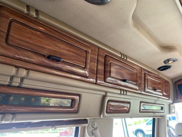 2004 Gold Ash Metallic /Medium Pebble Ford Econoline HIGH TOP CONVERSION VAN 1 OWNER LOW MILES 37,883 (1FDRE14L64H) with an 5.4L SOHC EFI V8 Triton Engine engine, Automatic transmission, located at 4701 North Dixie Hwy, Pompano Beach, FL, 33064, (954) 422-2889, 26.240938, -80.123474 - OUR WEBPAGE FLORIDACARS1.COM HAS OVER 100 PHOTOS AND FREE CARFAX LINK 2004 Ford Econoline E150 HIGH TOP CONVERSION VAN SHERROD 1 OWNER Van 5.4L V8 F SOHC 16V Gasoline 17 MPG Rear Wheel Drive Features ABS Brakes Air Conditioning Alloy Wheels AM/FM Stereo Automatic Transmission CD Audio Conversion Van - Photo#89