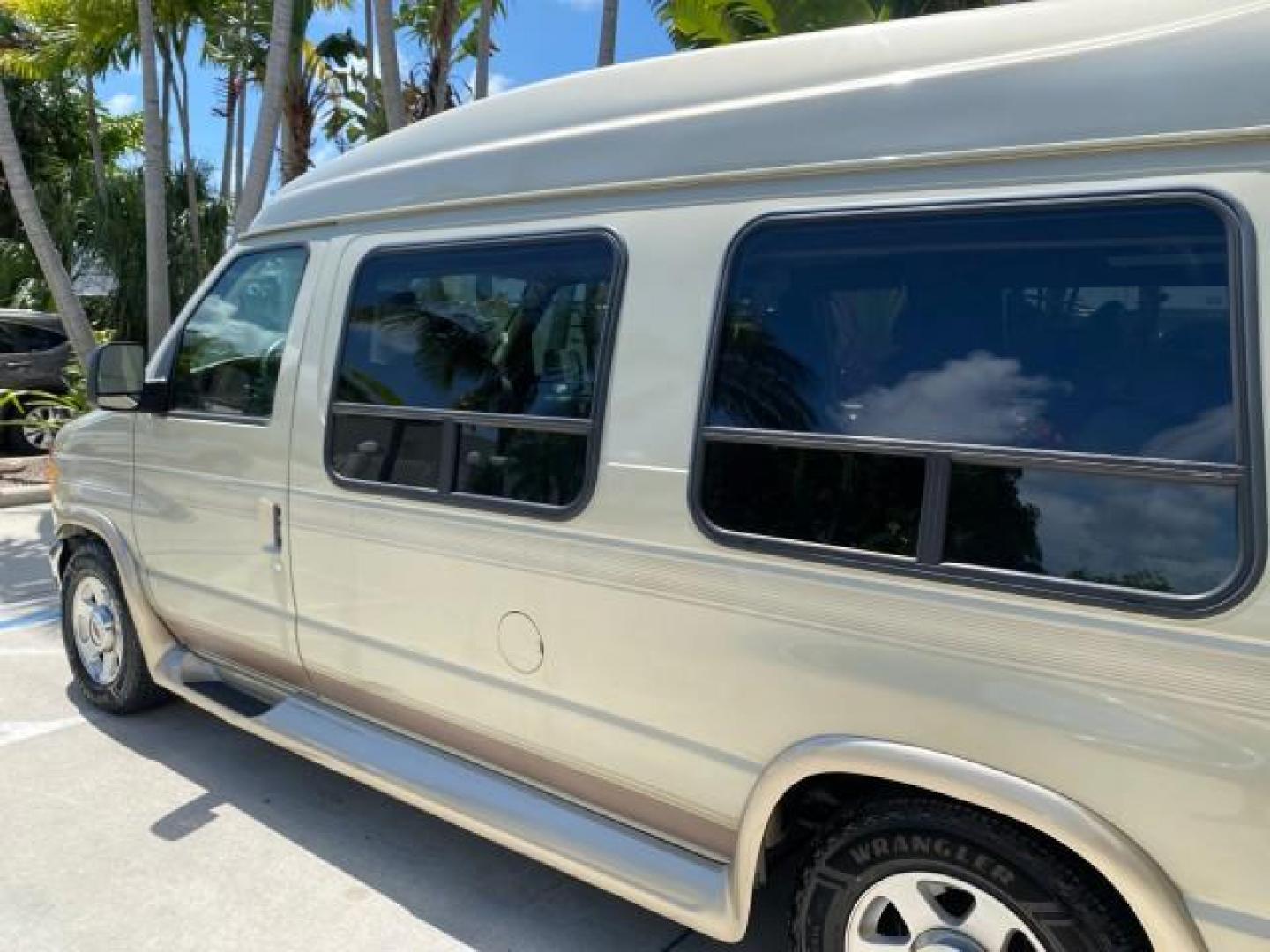 2004 Gold Ash Metallic /Medium Pebble Ford Econoline HIGH TOP CONVERSION VAN 1 OWNER LOW MILES 37,883 (1FDRE14L64H) with an 5.4L SOHC EFI V8 Triton Engine engine, Automatic transmission, located at 4701 North Dixie Hwy, Pompano Beach, FL, 33064, (954) 422-2889, 26.240938, -80.123474 - OUR WEBPAGE FLORIDACARS1.COM HAS OVER 100 PHOTOS AND FREE CARFAX LINK 2004 Ford Econoline E150 HIGH TOP CONVERSION VAN SHERROD 1 OWNER Van 5.4L V8 F SOHC 16V Gasoline 17 MPG Rear Wheel Drive Features ABS Brakes Air Conditioning Alloy Wheels AM/FM Stereo Automatic Transmission CD Audio Conversion Van- Photo#99