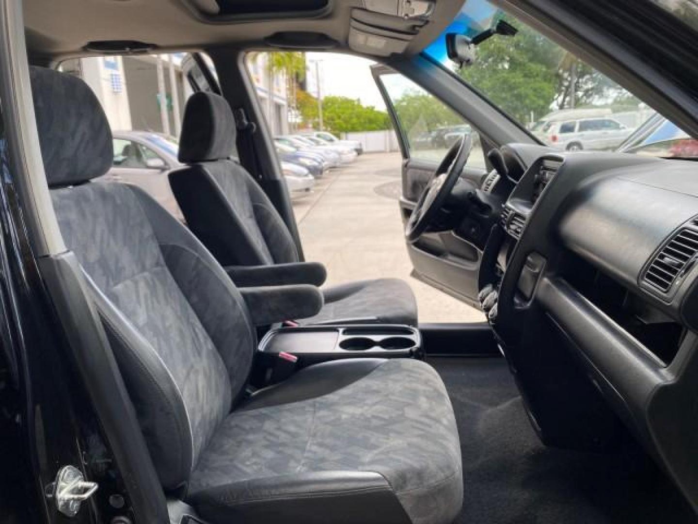 2004 Nighthawk Black Pearl /Black Honda CR-V 4WD EX LOW MILES 61,201 1 OWNER (SHSRD78874U) with an 2.4L DOHC PGM-FI 16-Valve i-VTEC I4 Engine engine, Automatic transmission, located at 4701 North Dixie Hwy, Pompano Beach, FL, 33064, (954) 422-2889, 26.240938, -80.123474 - OUR WEBPAGE FLORIDACARS1.COM HAS OVER 100 PHOTOS AND FREE CARFAX LINK 2004 Honda CR-V EX 1 OWNER 4 Door Wagon/Sport Utility 2.4L I4 F DOHC Gasoline 26 MPG All Wheel Drive Features Air Conditioning Alloy Wheels Cloth Seats Cruise Control Power Locks Power Mirrors Power Windows Sunroof(s) 2004 Honda C - Photo#12