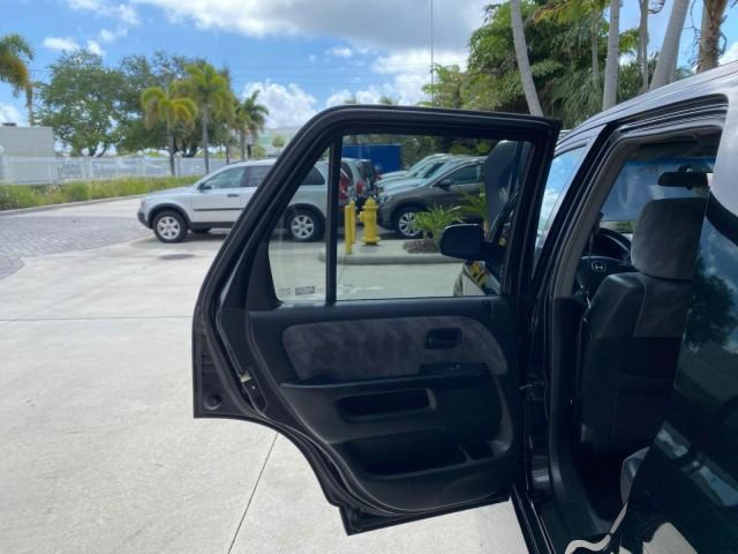 2004 Nighthawk Black Pearl /Black Honda CR-V 4WD EX LOW MILES 61,201 1 OWNER (SHSRD78874U) with an 2.4L DOHC PGM-FI 16-Valve i-VTEC I4 Engine engine, Automatic transmission, located at 4701 North Dixie Hwy, Pompano Beach, FL, 33064, (954) 422-2889, 26.240938, -80.123474 - OUR WEBPAGE FLORIDACARS1.COM HAS OVER 100 PHOTOS AND FREE CARFAX LINK 2004 Honda CR-V EX 1 OWNER 4 Door Wagon/Sport Utility 2.4L I4 F DOHC Gasoline 26 MPG All Wheel Drive Features Air Conditioning Alloy Wheels Cloth Seats Cruise Control Power Locks Power Mirrors Power Windows Sunroof(s) 2004 Honda C - Photo#13