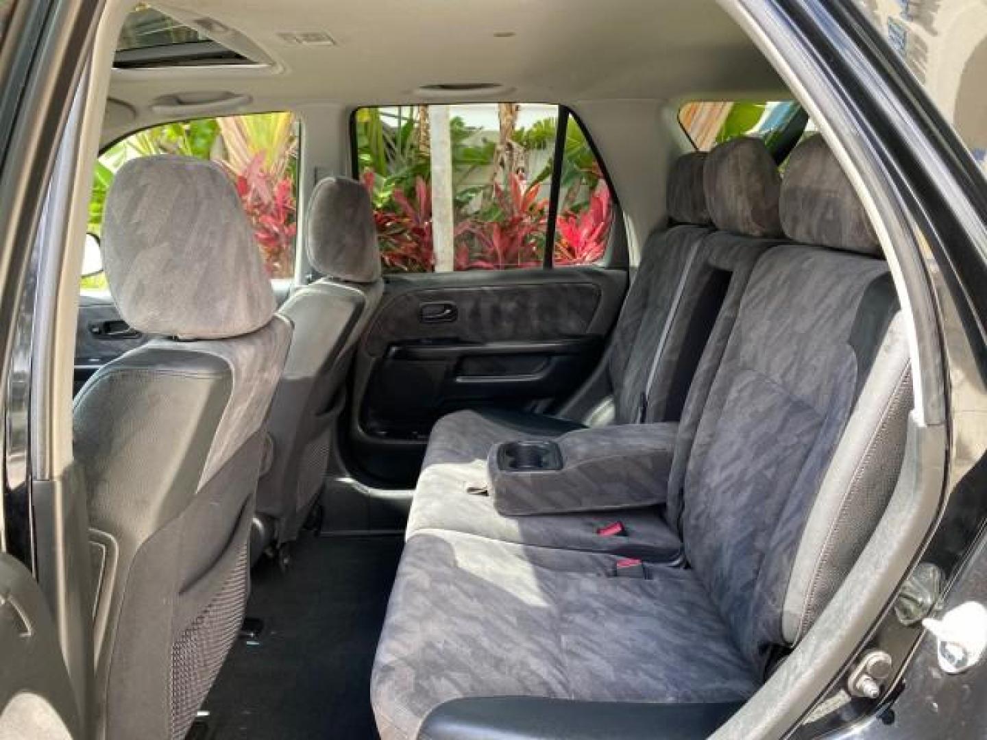2004 Nighthawk Black Pearl /Black Honda CR-V 4WD EX LOW MILES 61,201 1 OWNER (SHSRD78874U) with an 2.4L DOHC PGM-FI 16-Valve i-VTEC I4 Engine engine, Automatic transmission, located at 4701 North Dixie Hwy, Pompano Beach, FL, 33064, (954) 422-2889, 26.240938, -80.123474 - OUR WEBPAGE FLORIDACARS1.COM HAS OVER 100 PHOTOS AND FREE CARFAX LINK 2004 Honda CR-V EX 1 OWNER 4 Door Wagon/Sport Utility 2.4L I4 F DOHC Gasoline 26 MPG All Wheel Drive Features Air Conditioning Alloy Wheels Cloth Seats Cruise Control Power Locks Power Mirrors Power Windows Sunroof(s) 2004 Honda C - Photo#77