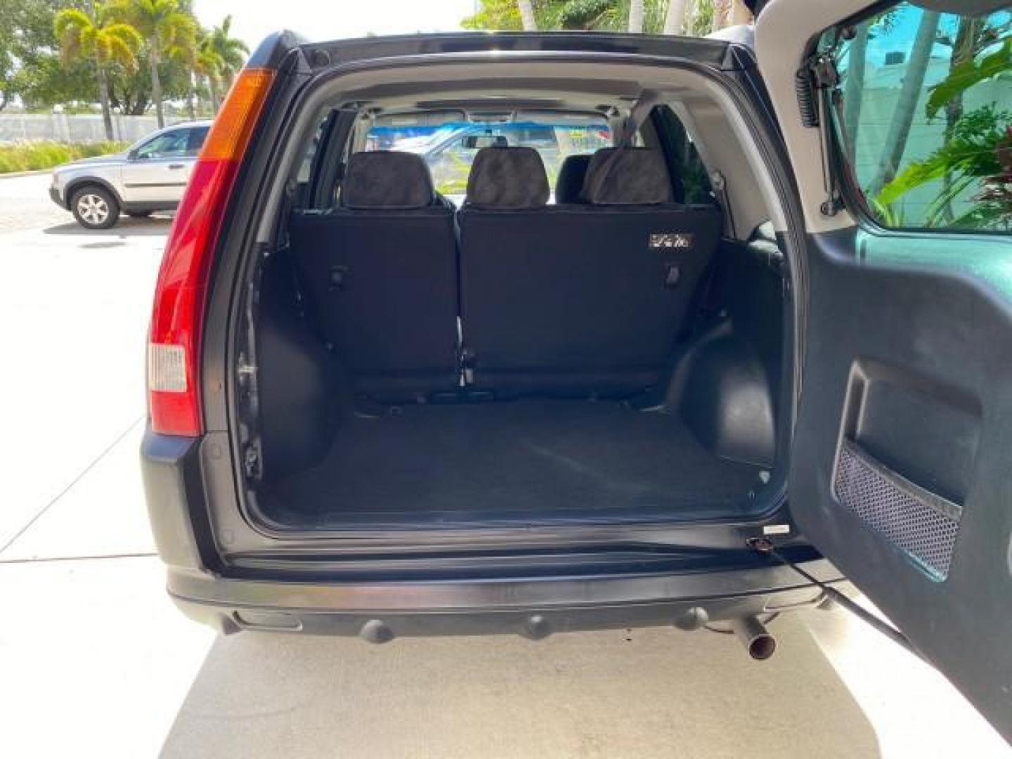 2004 Nighthawk Black Pearl /Black Honda CR-V 4WD EX LOW MILES 61,201 1 OWNER (SHSRD78874U) with an 2.4L DOHC PGM-FI 16-Valve i-VTEC I4 Engine engine, Automatic transmission, located at 4701 North Dixie Hwy, Pompano Beach, FL, 33064, (954) 422-2889, 26.240938, -80.123474 - OUR WEBPAGE FLORIDACARS1.COM HAS OVER 100 PHOTOS AND FREE CARFAX LINK 2004 Honda CR-V EX 1 OWNER 4 Door Wagon/Sport Utility 2.4L I4 F DOHC Gasoline 26 MPG All Wheel Drive Features Air Conditioning Alloy Wheels Cloth Seats Cruise Control Power Locks Power Mirrors Power Windows Sunroof(s) 2004 Honda C - Photo#97