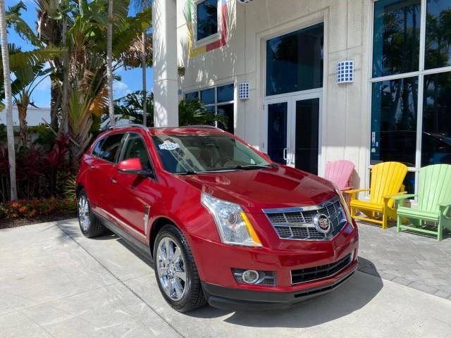2012 Crystal Red Tintcoat /Shale w/Brownstone accents Cadillac SRX Performance Collection LOW MILES 34,731 (3GYFNBE32CS) with an 3.6L SIDI DOHC V6 VVT Engine engine, Automatic transmission, located at 4701 North Dixie Hwy, Pompano Beach, FL, 33064, (954) 422-2889, 26.240938, -80.123474 - OUR WEBPAGE FLORIDACARS1.COM HAS OVER 100 PHOTOS AND FREE CARFAX LINK 2012 Cadillac SRX 1 OWNER 4 Door Wagon/Sport Utility 3.6L V6 F DOHC 24V Gasoline 24 MPG Front Wheel Drive Features 20 Inch Plus Wheels ABS Brakes Air Conditioning Alloy Wheels AM/FM Stereo Automatic Transmission Auxiliary Audio In - Photo#1