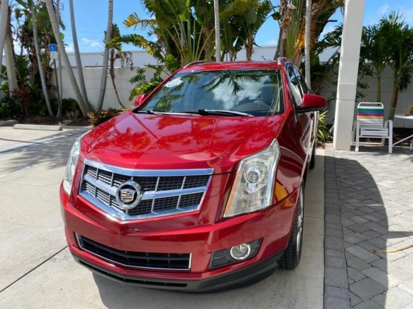 2012 Crystal Red Tintcoat /Shale w/Brownstone accents Cadillac SRX Performance Collection LOW MILES 34,731 (3GYFNBE32CS) with an 3.6L SIDI DOHC V6 VVT Engine engine, Automatic transmission, located at 4701 North Dixie Hwy, Pompano Beach, FL, 33064, (954) 422-2889, 26.240938, -80.123474 - OUR WEBPAGE FLORIDACARS1.COM HAS OVER 100 PHOTOS AND FREE CARFAX LINK 2012 Cadillac SRX 1 OWNER 4 Door Wagon/Sport Utility 3.6L V6 F DOHC 24V Gasoline 24 MPG Front Wheel Drive Features 20 Inch Plus Wheels ABS Brakes Air Conditioning Alloy Wheels AM/FM Stereo Automatic Transmission Auxiliary Audio In- Photo#3