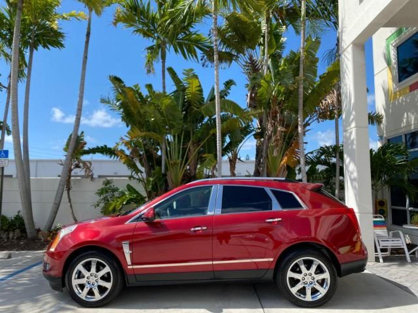 2012 Crystal Red Tintcoat /Shale w/Brownstone accents Cadillac SRX Performance Collection LOW MILES 34,731 (3GYFNBE32CS) with an 3.6L SIDI DOHC V6 VVT Engine engine, Automatic transmission, located at 4701 North Dixie Hwy, Pompano Beach, FL, 33064, (954) 422-2889, 26.240938, -80.123474 - OUR WEBPAGE FLORIDACARS1.COM HAS OVER 100 PHOTOS AND FREE CARFAX LINK 2012 Cadillac SRX 1 OWNER 4 Door Wagon/Sport Utility 3.6L V6 F DOHC 24V Gasoline 24 MPG Front Wheel Drive Features 20 Inch Plus Wheels ABS Brakes Air Conditioning Alloy Wheels AM/FM Stereo Automatic Transmission Auxiliary Audio In- Photo#4