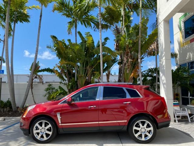 2012 Crystal Red Tintcoat /Shale w/Brownstone accents Cadillac SRX Performance Collection LOW MILES 34,731 (3GYFNBE32CS) with an 3.6L SIDI DOHC V6 VVT Engine engine, Automatic transmission, located at 4701 North Dixie Hwy, Pompano Beach, FL, 33064, (954) 422-2889, 26.240938, -80.123474 - OUR WEBPAGE FLORIDACARS1.COM HAS OVER 100 PHOTOS AND FREE CARFAX LINK 2012 Cadillac SRX 1 OWNER 4 Door Wagon/Sport Utility 3.6L V6 F DOHC 24V Gasoline 24 MPG Front Wheel Drive Features 20 Inch Plus Wheels ABS Brakes Air Conditioning Alloy Wheels AM/FM Stereo Automatic Transmission Auxiliary Audio In - Photo#4