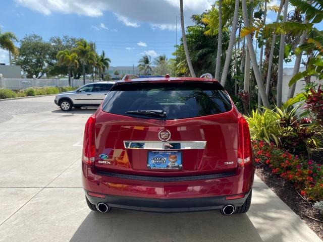 2012 Crystal Red Tintcoat /Shale w/Brownstone accents Cadillac SRX Performance Collection LOW MILES 34,731 (3GYFNBE32CS) with an 3.6L SIDI DOHC V6 VVT Engine engine, Automatic transmission, located at 4701 North Dixie Hwy, Pompano Beach, FL, 33064, (954) 422-2889, 26.240938, -80.123474 - OUR WEBPAGE FLORIDACARS1.COM HAS OVER 100 PHOTOS AND FREE CARFAX LINK 2012 Cadillac SRX 1 OWNER 4 Door Wagon/Sport Utility 3.6L V6 F DOHC 24V Gasoline 24 MPG Front Wheel Drive Features 20 Inch Plus Wheels ABS Brakes Air Conditioning Alloy Wheels AM/FM Stereo Automatic Transmission Auxiliary Audio In - Photo#6