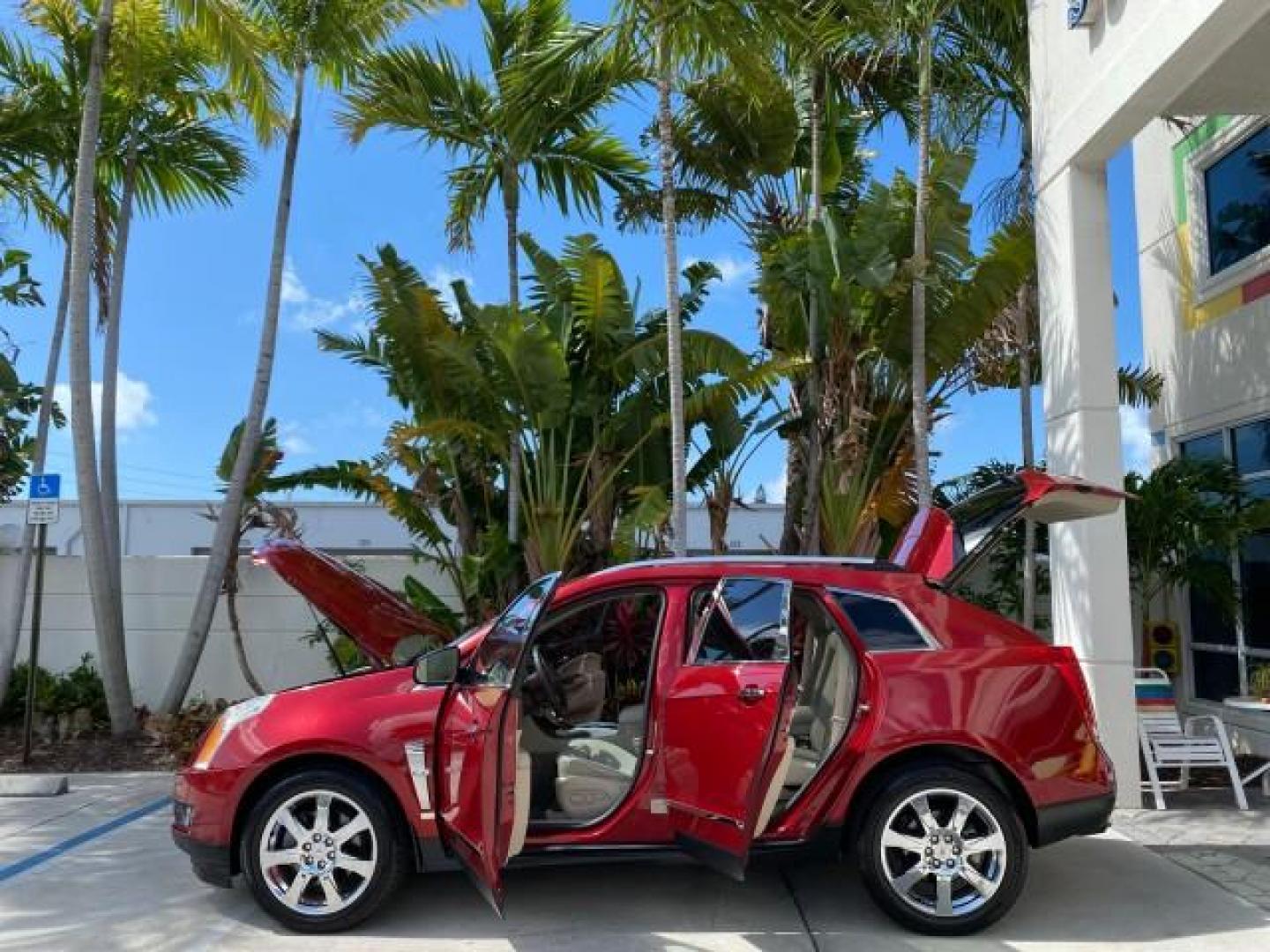 2012 Crystal Red Tintcoat /Shale w/Brownstone accents Cadillac SRX Performance Collection LOW MILES 34,731 (3GYFNBE32CS) with an 3.6L SIDI DOHC V6 VVT Engine engine, Automatic transmission, located at 4701 North Dixie Hwy, Pompano Beach, FL, 33064, (954) 422-2889, 26.240938, -80.123474 - OUR WEBPAGE FLORIDACARS1.COM HAS OVER 100 PHOTOS AND FREE CARFAX LINK 2012 Cadillac SRX 1 OWNER 4 Door Wagon/Sport Utility 3.6L V6 F DOHC 24V Gasoline 24 MPG Front Wheel Drive Features 20 Inch Plus Wheels ABS Brakes Air Conditioning Alloy Wheels AM/FM Stereo Automatic Transmission Auxiliary Audio In- Photo#8