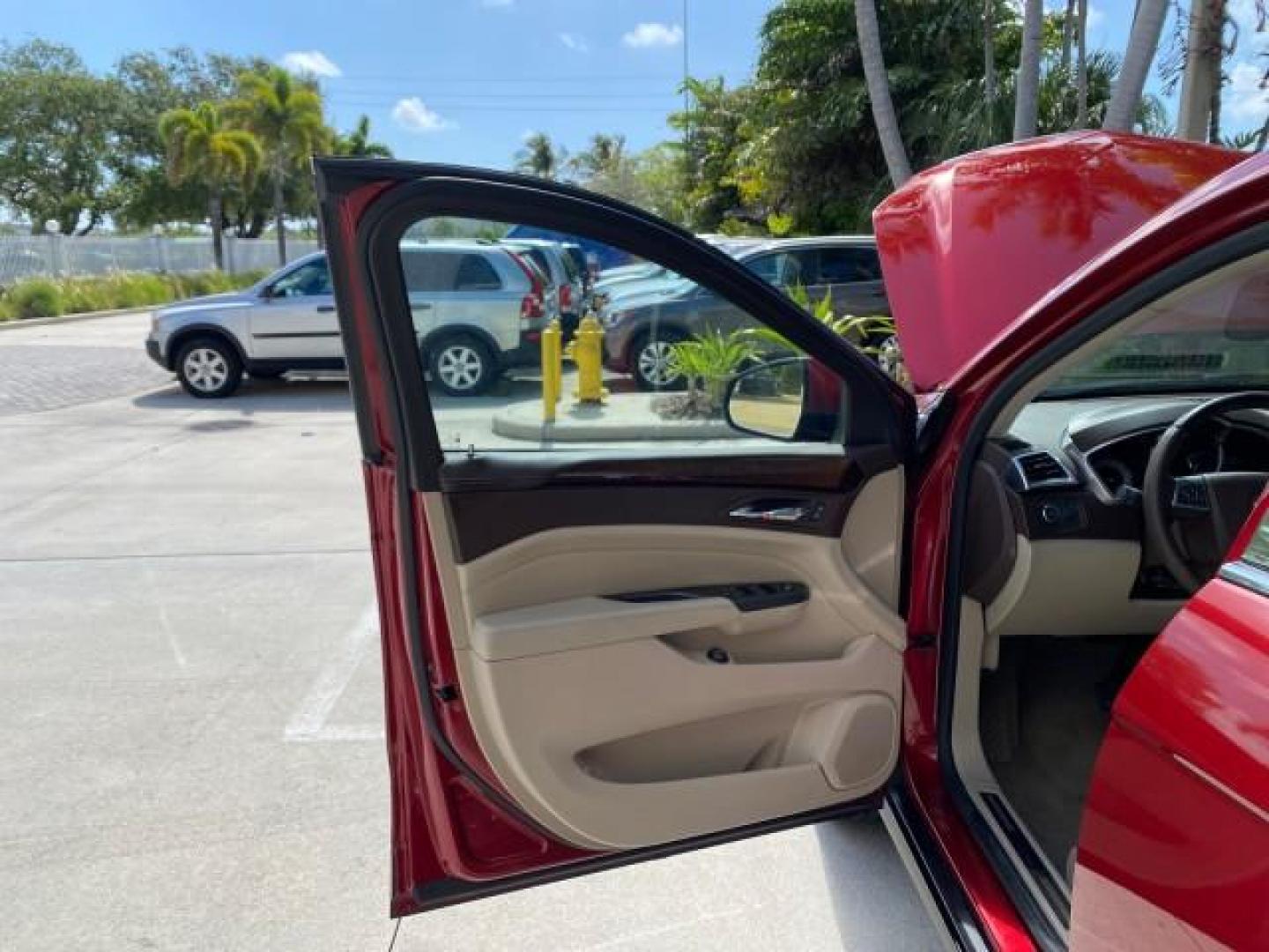 2012 Crystal Red Tintcoat /Shale w/Brownstone accents Cadillac SRX Performance Collection LOW MILES 34,731 (3GYFNBE32CS) with an 3.6L SIDI DOHC V6 VVT Engine engine, Automatic transmission, located at 4701 North Dixie Hwy, Pompano Beach, FL, 33064, (954) 422-2889, 26.240938, -80.123474 - OUR WEBPAGE FLORIDACARS1.COM HAS OVER 100 PHOTOS AND FREE CARFAX LINK 2012 Cadillac SRX 1 OWNER 4 Door Wagon/Sport Utility 3.6L V6 F DOHC 24V Gasoline 24 MPG Front Wheel Drive Features 20 Inch Plus Wheels ABS Brakes Air Conditioning Alloy Wheels AM/FM Stereo Automatic Transmission Auxiliary Audio In- Photo#9