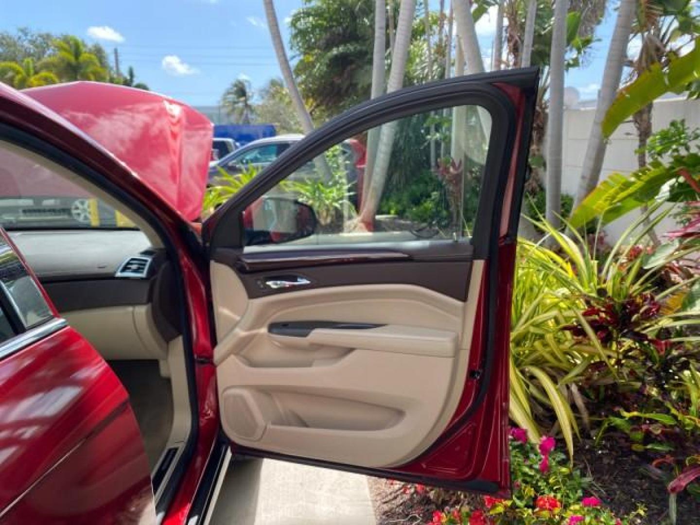 2012 Crystal Red Tintcoat /Shale w/Brownstone accents Cadillac SRX Performance Collection LOW MILES 34,731 (3GYFNBE32CS) with an 3.6L SIDI DOHC V6 VVT Engine engine, Automatic transmission, located at 4701 North Dixie Hwy, Pompano Beach, FL, 33064, (954) 422-2889, 26.240938, -80.123474 - OUR WEBPAGE FLORIDACARS1.COM HAS OVER 100 PHOTOS AND FREE CARFAX LINK 2012 Cadillac SRX 1 OWNER 4 Door Wagon/Sport Utility 3.6L V6 F DOHC 24V Gasoline 24 MPG Front Wheel Drive Features 20 Inch Plus Wheels ABS Brakes Air Conditioning Alloy Wheels AM/FM Stereo Automatic Transmission Auxiliary Audio In- Photo#11