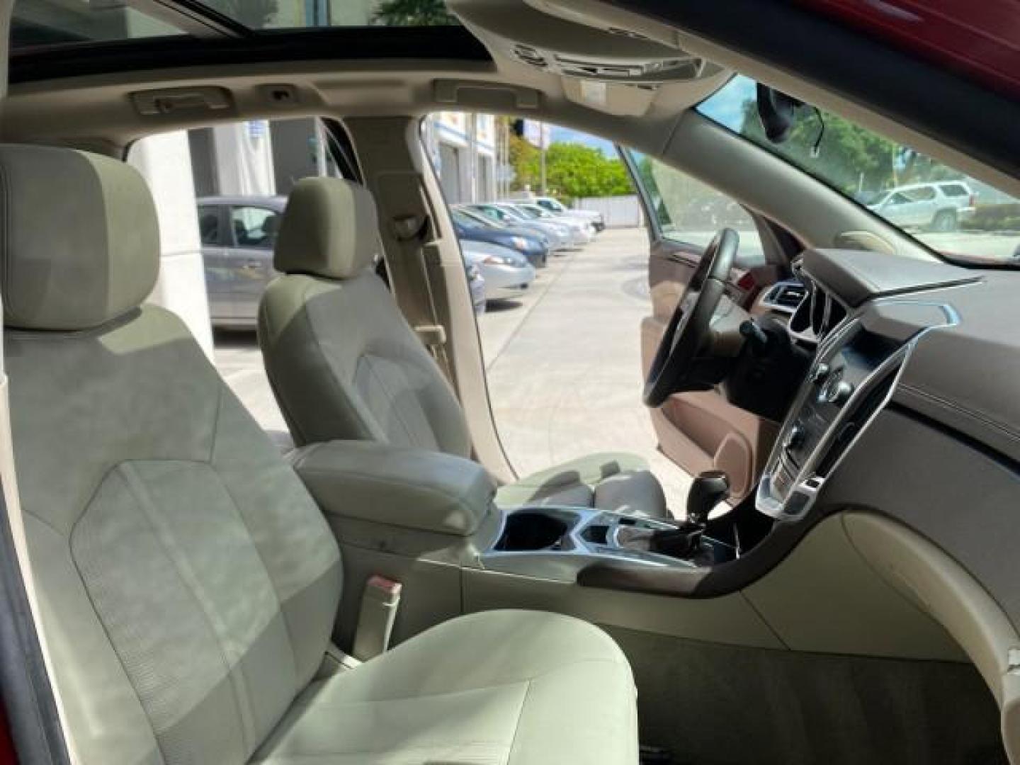 2012 Crystal Red Tintcoat /Shale w/Brownstone accents Cadillac SRX Performance Collection LOW MILES 34,731 (3GYFNBE32CS) with an 3.6L SIDI DOHC V6 VVT Engine engine, Automatic transmission, located at 4701 North Dixie Hwy, Pompano Beach, FL, 33064, (954) 422-2889, 26.240938, -80.123474 - OUR WEBPAGE FLORIDACARS1.COM HAS OVER 100 PHOTOS AND FREE CARFAX LINK 2012 Cadillac SRX 1 OWNER 4 Door Wagon/Sport Utility 3.6L V6 F DOHC 24V Gasoline 24 MPG Front Wheel Drive Features 20 Inch Plus Wheels ABS Brakes Air Conditioning Alloy Wheels AM/FM Stereo Automatic Transmission Auxiliary Audio In- Photo#12
