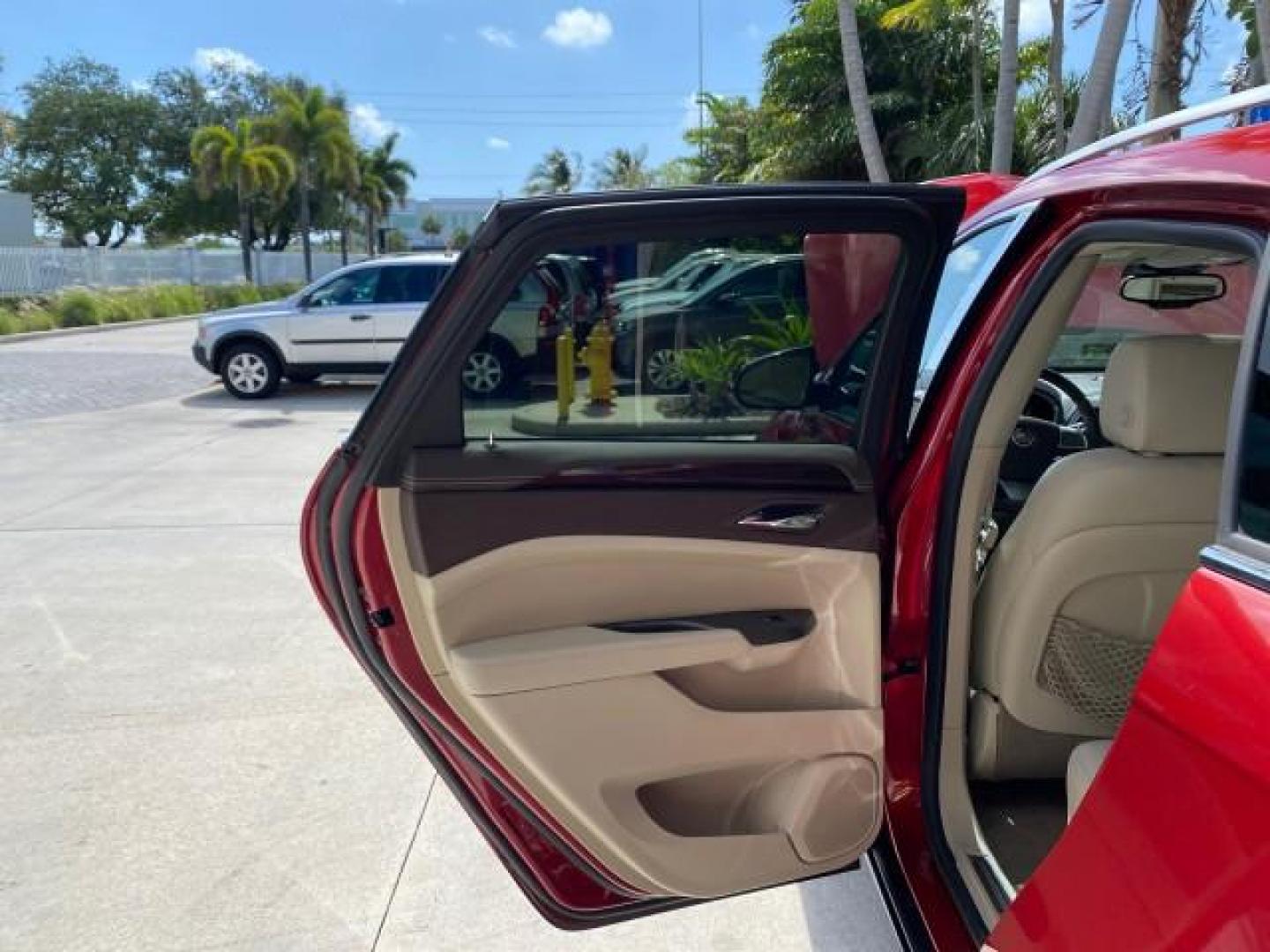 2012 Crystal Red Tintcoat /Shale w/Brownstone accents Cadillac SRX Performance Collection LOW MILES 34,731 (3GYFNBE32CS) with an 3.6L SIDI DOHC V6 VVT Engine engine, Automatic transmission, located at 4701 North Dixie Hwy, Pompano Beach, FL, 33064, (954) 422-2889, 26.240938, -80.123474 - OUR WEBPAGE FLORIDACARS1.COM HAS OVER 100 PHOTOS AND FREE CARFAX LINK 2012 Cadillac SRX 1 OWNER 4 Door Wagon/Sport Utility 3.6L V6 F DOHC 24V Gasoline 24 MPG Front Wheel Drive Features 20 Inch Plus Wheels ABS Brakes Air Conditioning Alloy Wheels AM/FM Stereo Automatic Transmission Auxiliary Audio In- Photo#13