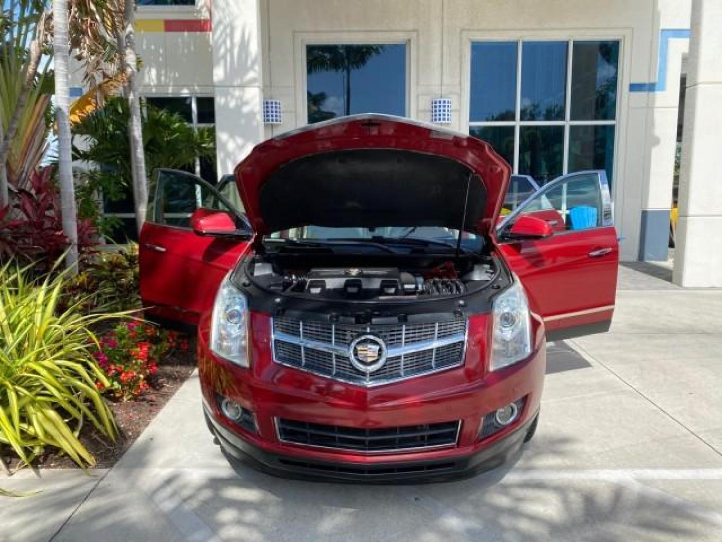 2012 Crystal Red Tintcoat /Shale w/Brownstone accents Cadillac SRX Performance Collection LOW MILES 34,731 (3GYFNBE32CS) with an 3.6L SIDI DOHC V6 VVT Engine engine, Automatic transmission, located at 4701 North Dixie Hwy, Pompano Beach, FL, 33064, (954) 422-2889, 26.240938, -80.123474 - OUR WEBPAGE FLORIDACARS1.COM HAS OVER 100 PHOTOS AND FREE CARFAX LINK 2012 Cadillac SRX 1 OWNER 4 Door Wagon/Sport Utility 3.6L V6 F DOHC 24V Gasoline 24 MPG Front Wheel Drive Features 20 Inch Plus Wheels ABS Brakes Air Conditioning Alloy Wheels AM/FM Stereo Automatic Transmission Auxiliary Audio In- Photo#16